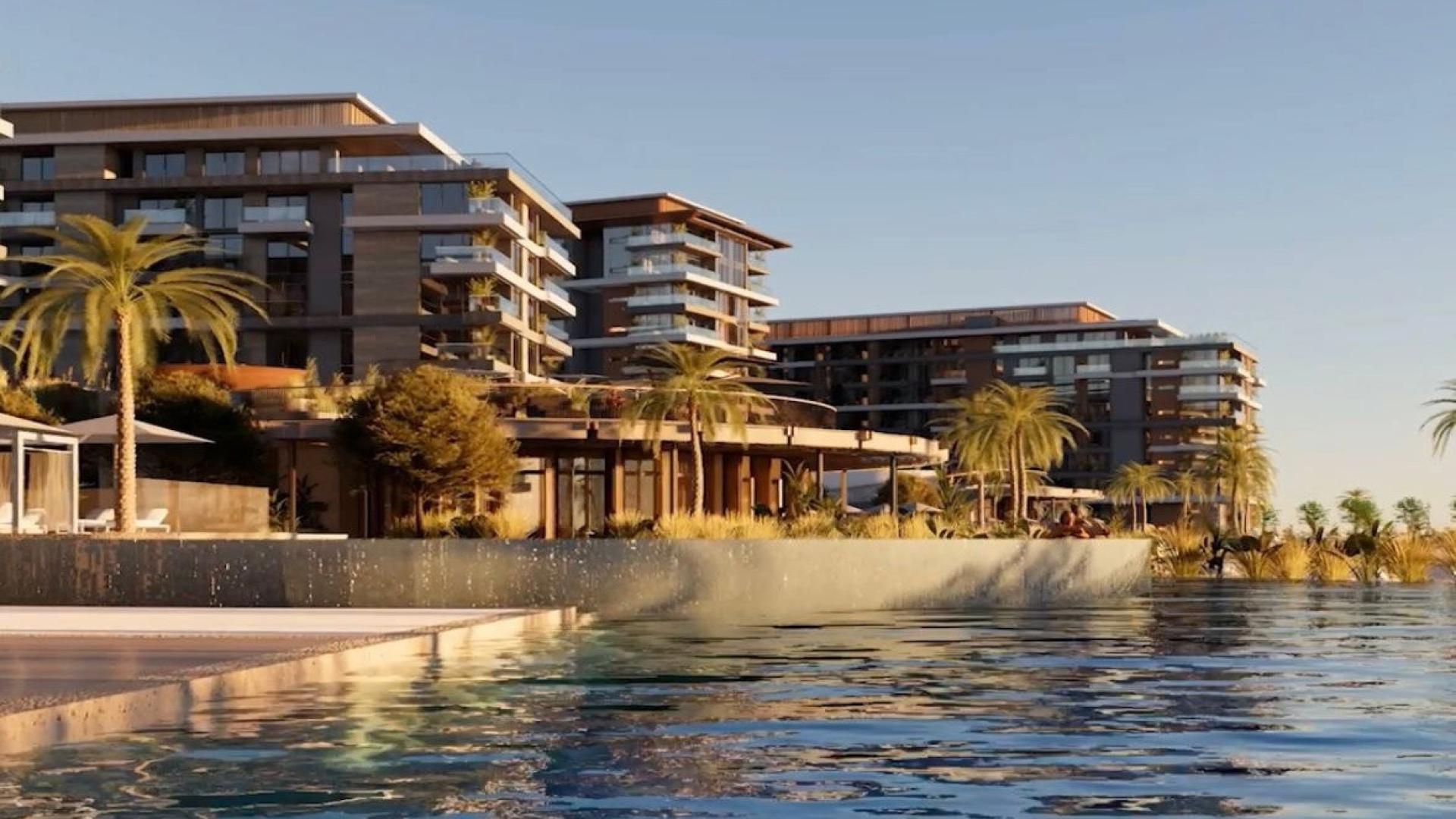 Luxury waterfront apartments in Ellington Cove, Dubai Islands with modern architecture and palm trees