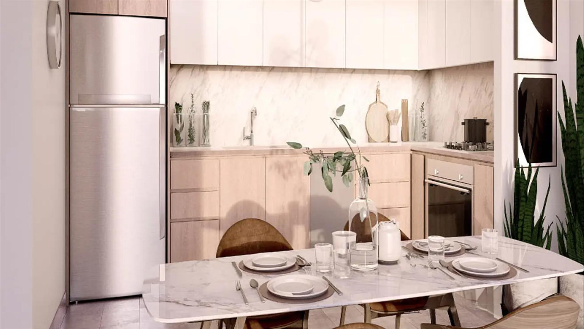 N/A,Modern kitchen in Dubai Hills Estate apartment, featuring marble countertops and sleek appliances