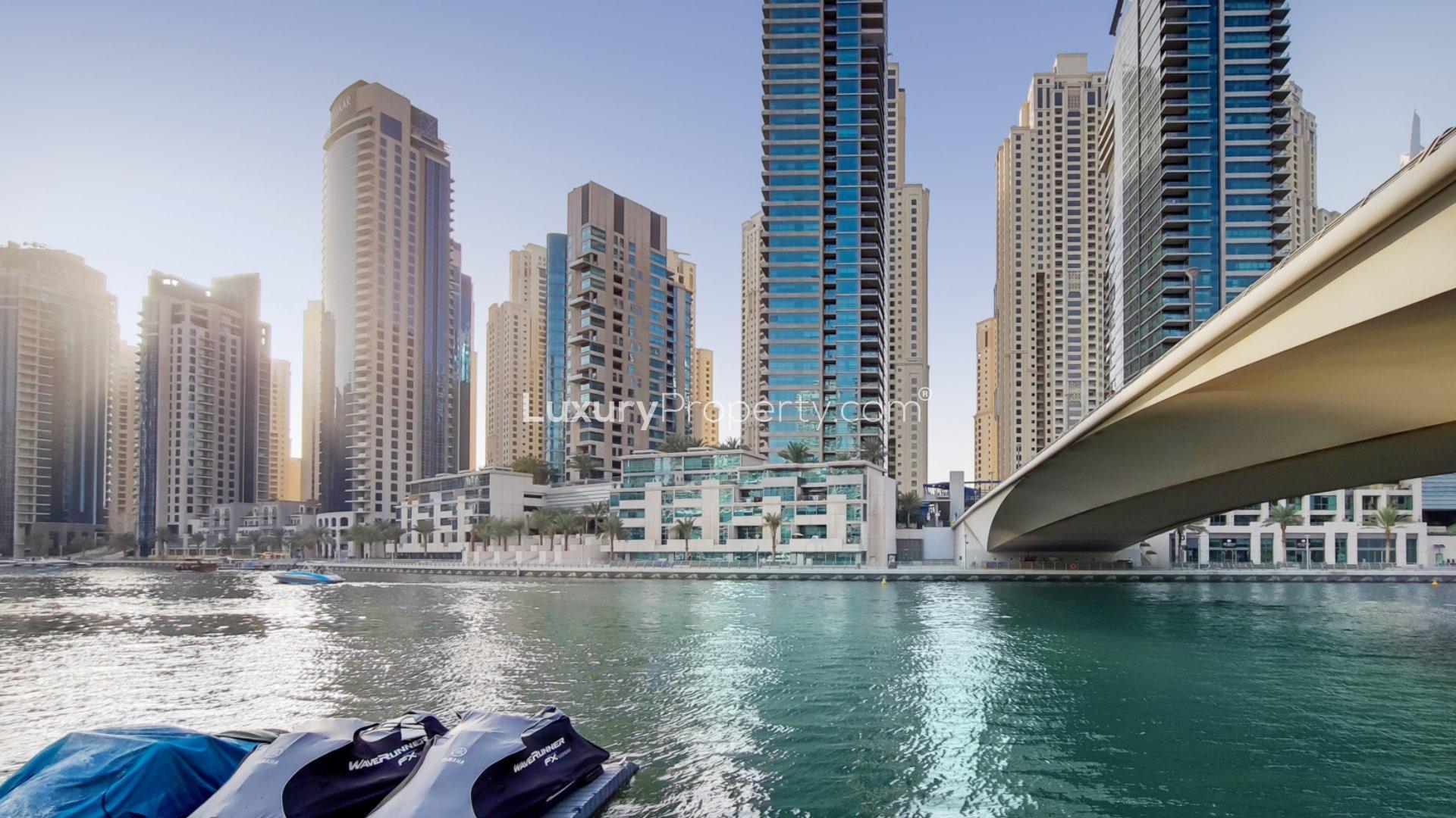 High-floor apartment with large windows, tiled floors, and city views in Dubai Marina, Al Sahab
