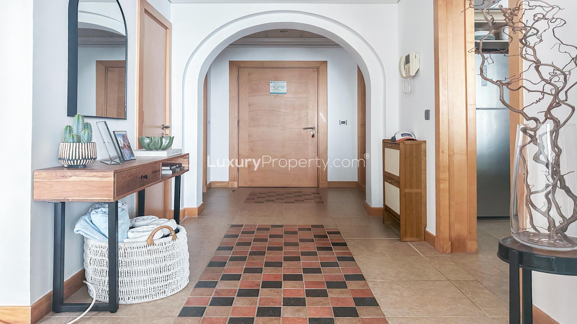 Balcony view of Palm Jumeirah shoreline apartment for sale, overlooking the sea and beach