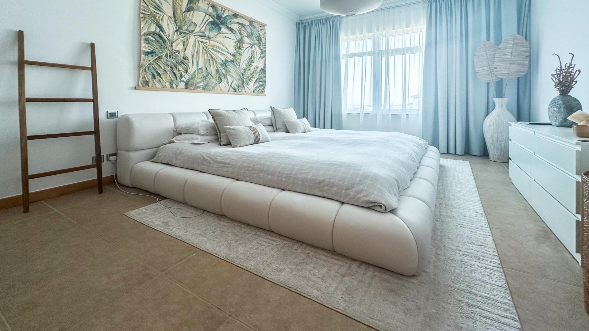 Cozy living room in Shoreline Apartments, Palm Jumeirah, with modern decor and neutral tones