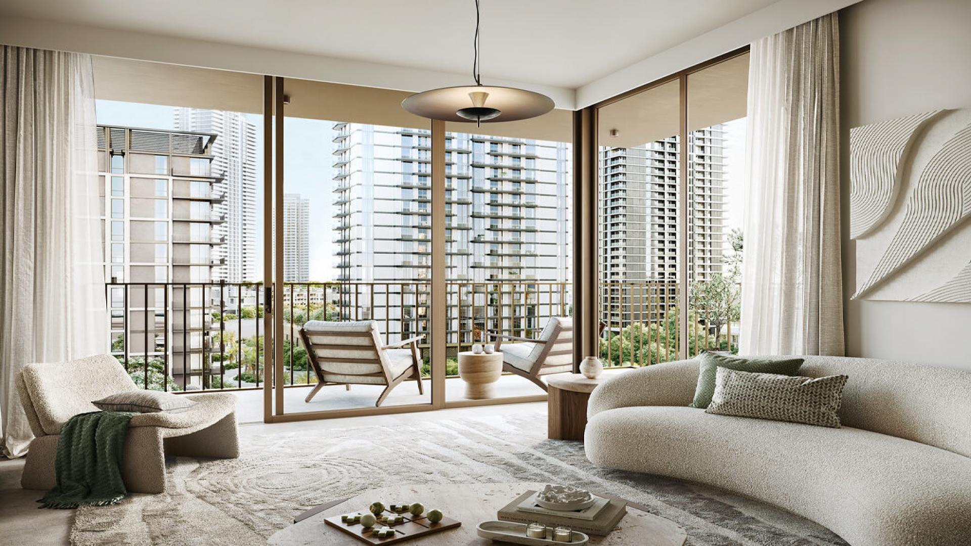 Modern living room in Oria Creek Beach apartment, Dubai Creek Harbour, with city view balcony