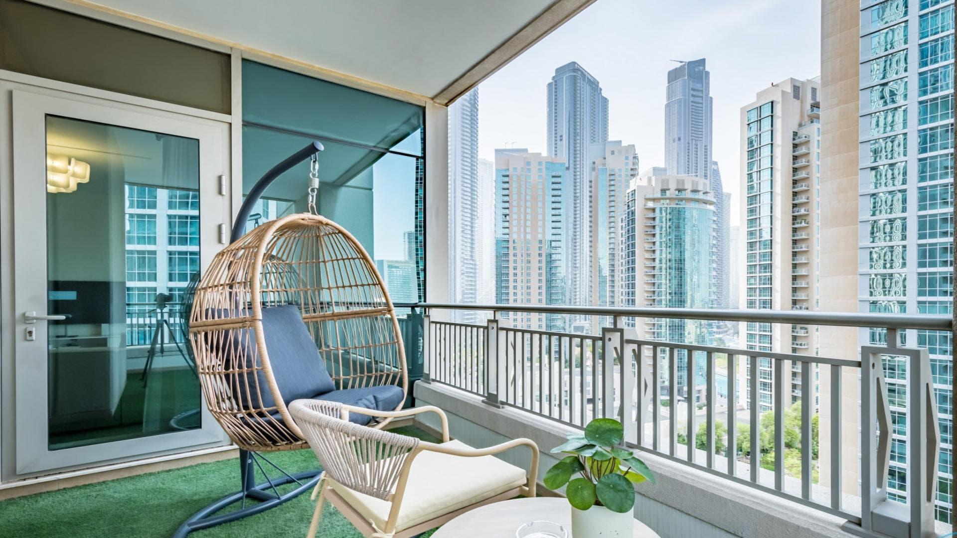 Modern living room in Boulevard Central Towers apartment, Downtown Dubai, with city view