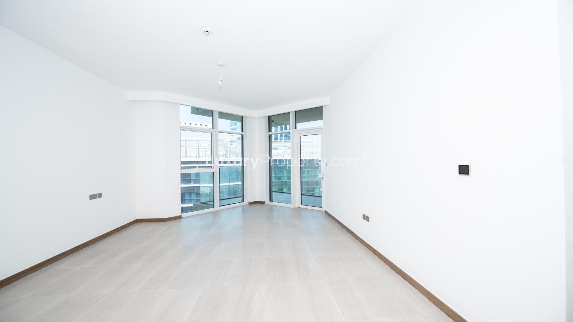 Balcony view from 2-bedroom apartment in Business Bay's Urban Oasis, showcasing city skyline