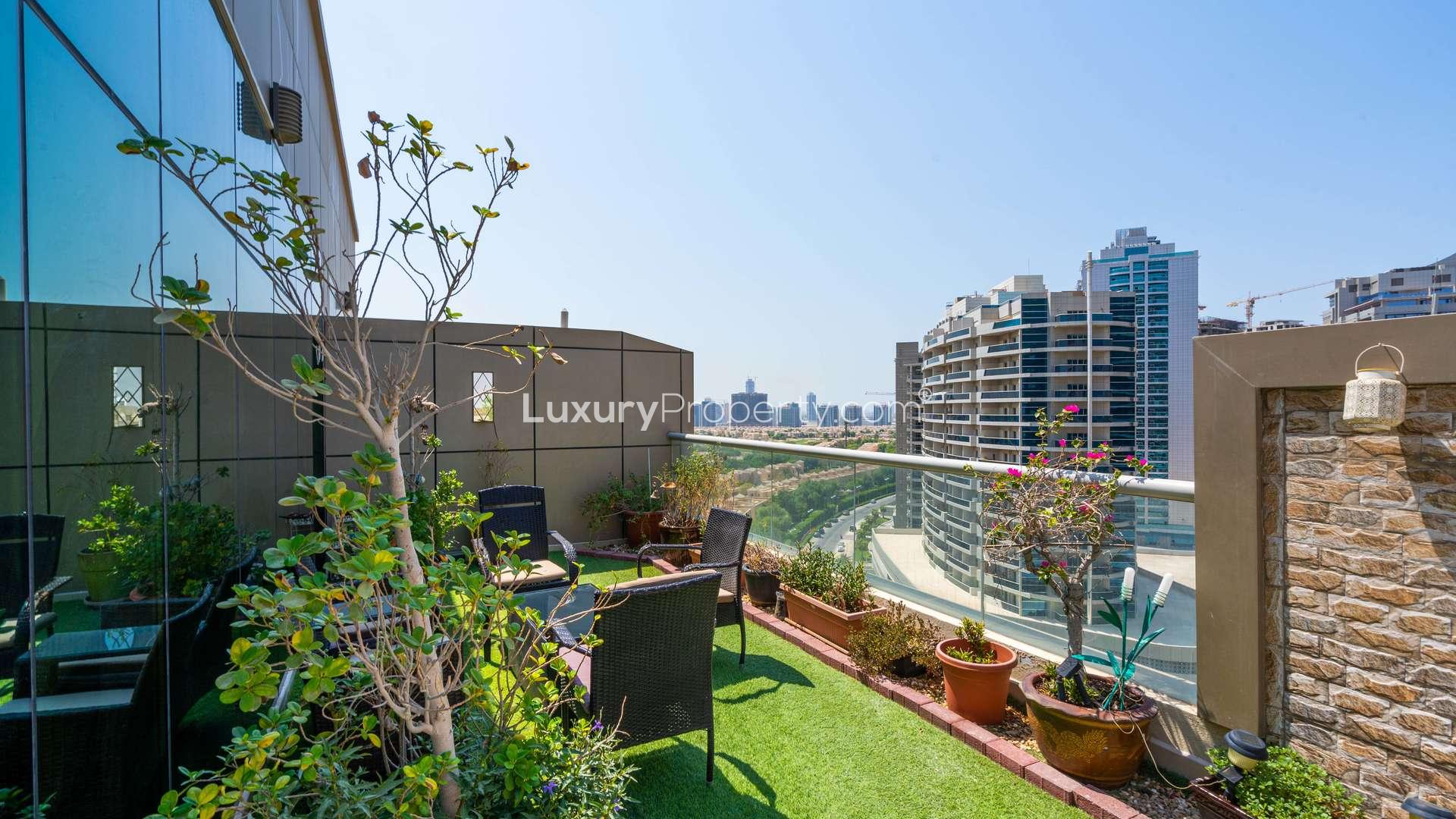 Luxurious living room in penthouse at Arena Apartments, Dubai Sports City, with elegant decor