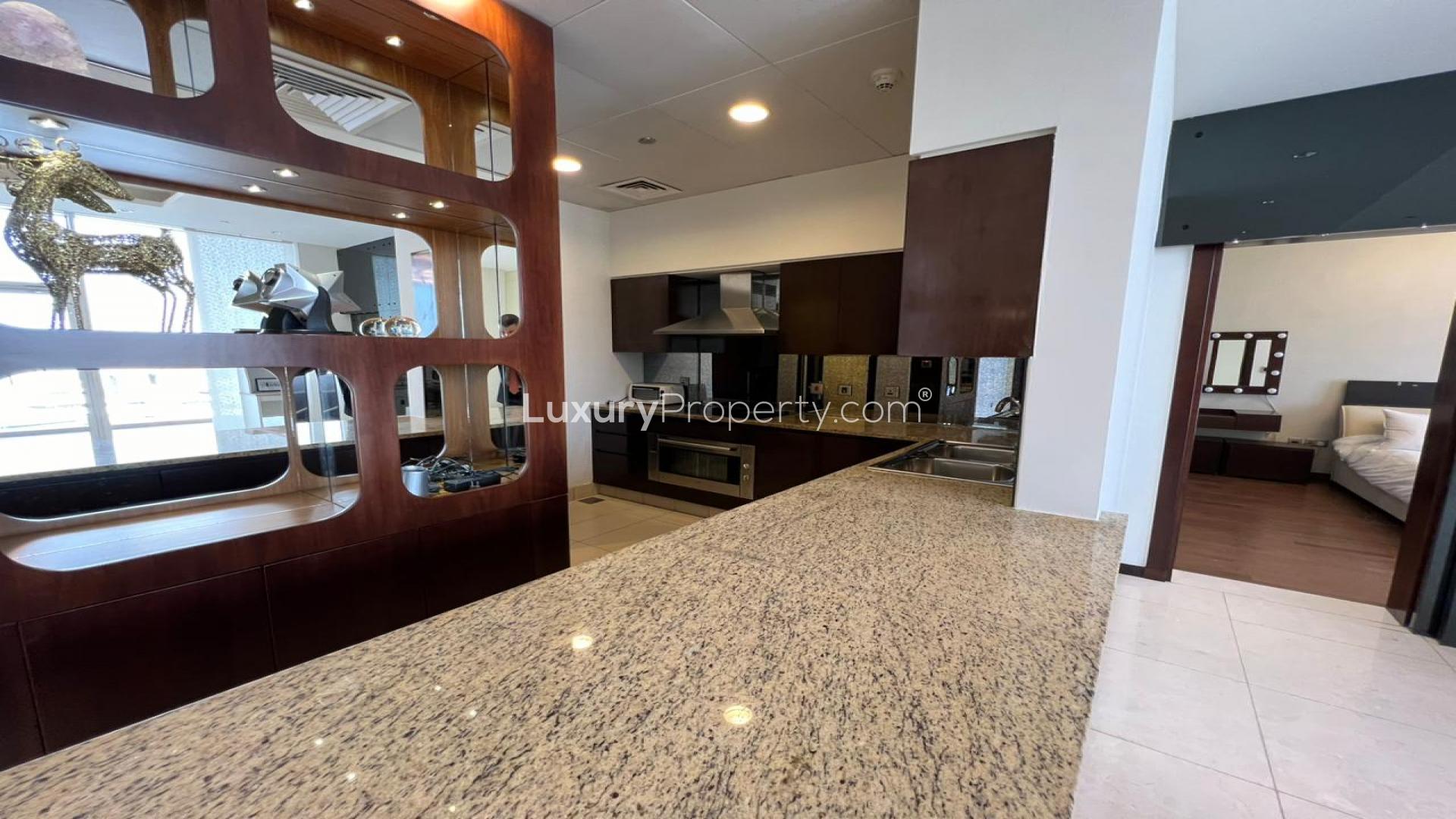 Luxurious open-plan living area with waterfront views in Tiara Residences, Palm Jumeirah apartment
