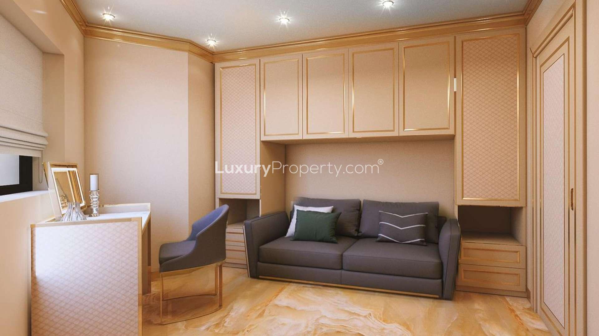 Furnished living room in renovated Old Town Island apartment, elegant decor with chandelier and art