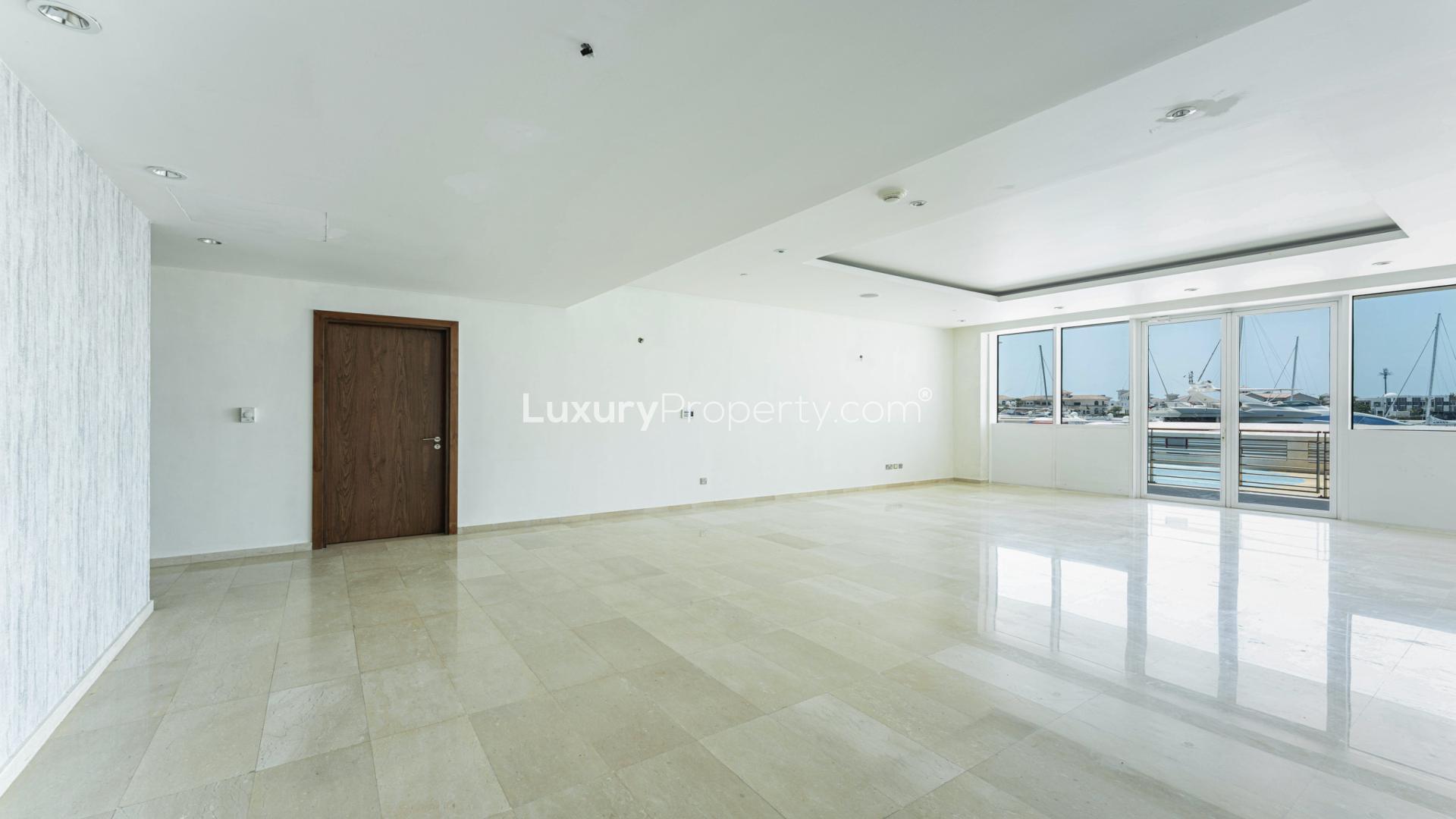 Empty living room with sea view in Palm Jumeirah beachfront apartment for sale