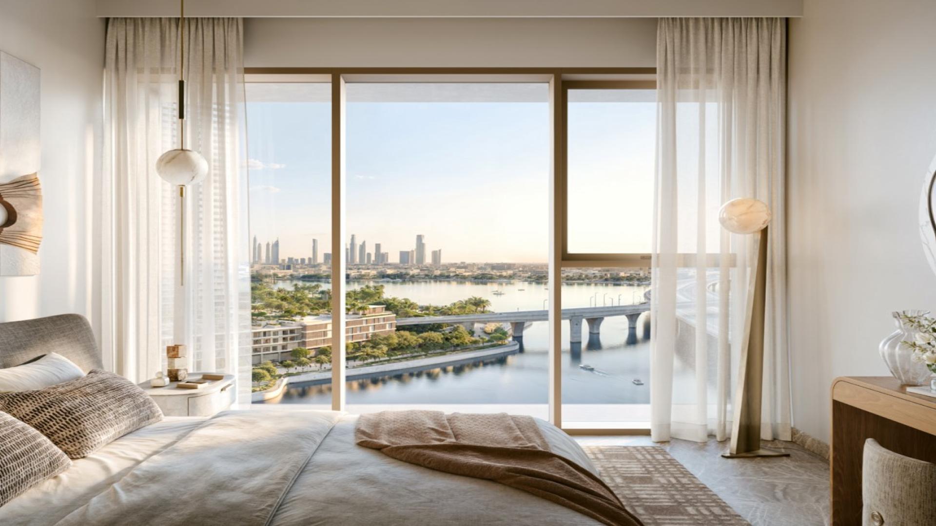 Luxurious living room with stunning Dubai Creek Harbour view, Palace Residences Creek Blue apartment