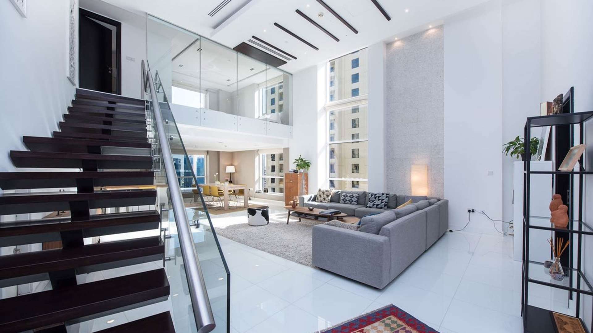 New York-style loft bedroom with modern design in Bahar, JBR, featuring skyline views