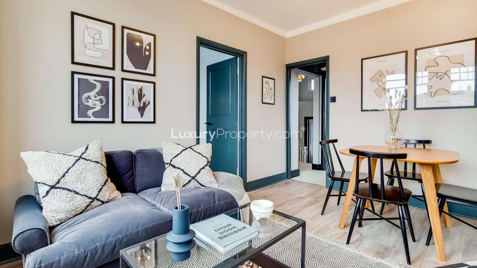 Cozy living area in Queenstown Road apartment, Battersea, featuring stylish decor and large windows