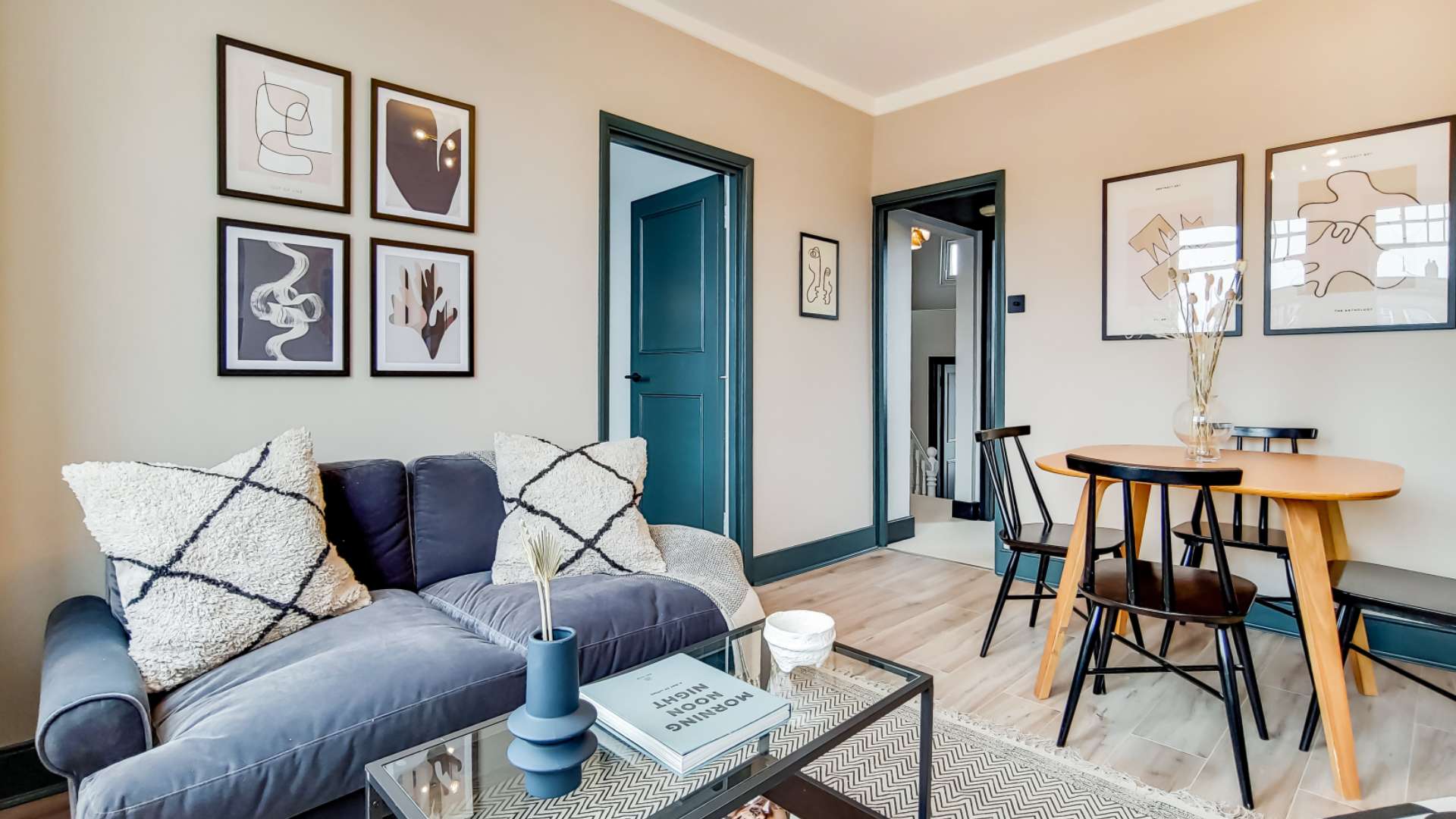 Cozy living area in Queenstown Road apartment, Battersea, featuring stylish decor and large windows
