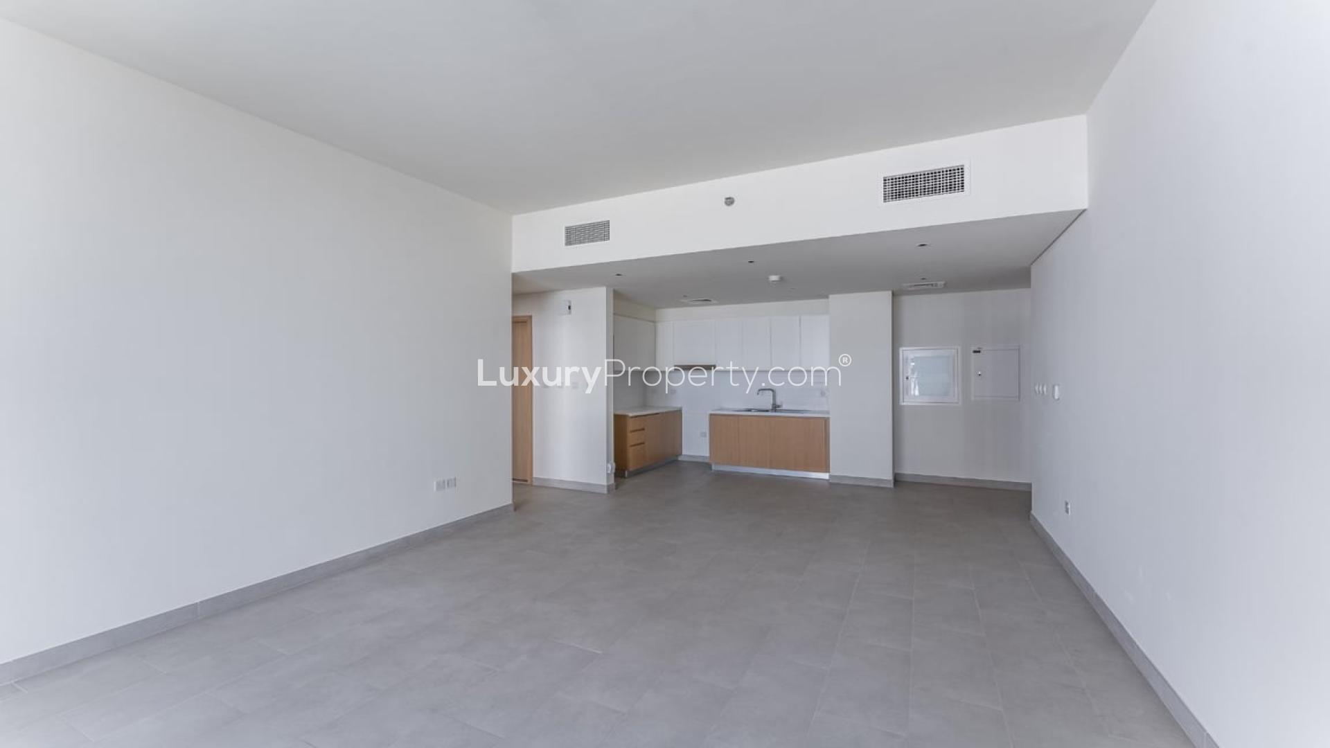 Modern kitchen in Creek Rise apartment, Dubai Creek Harbour. Spacious design with sleek cabinetry