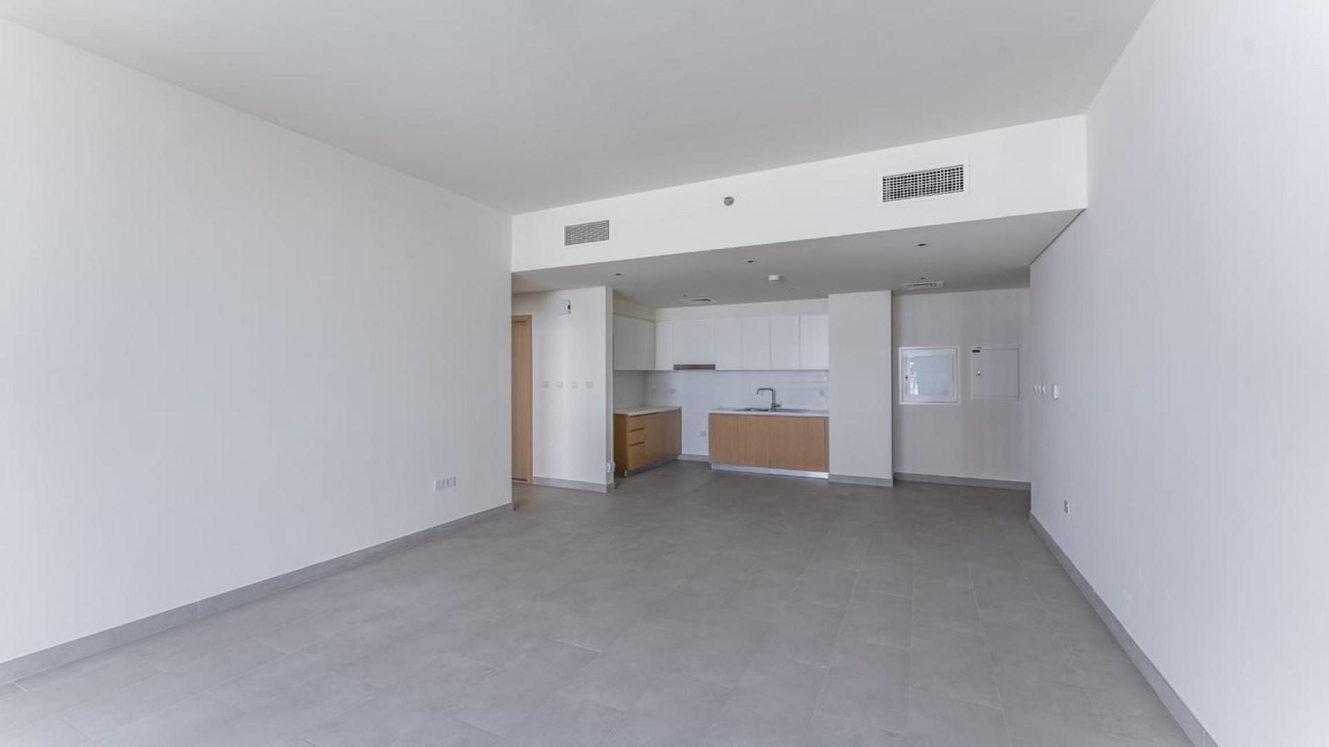 Modern kitchen in Creek Rise apartment, Dubai Creek Harbour. Spacious design with sleek cabinetry