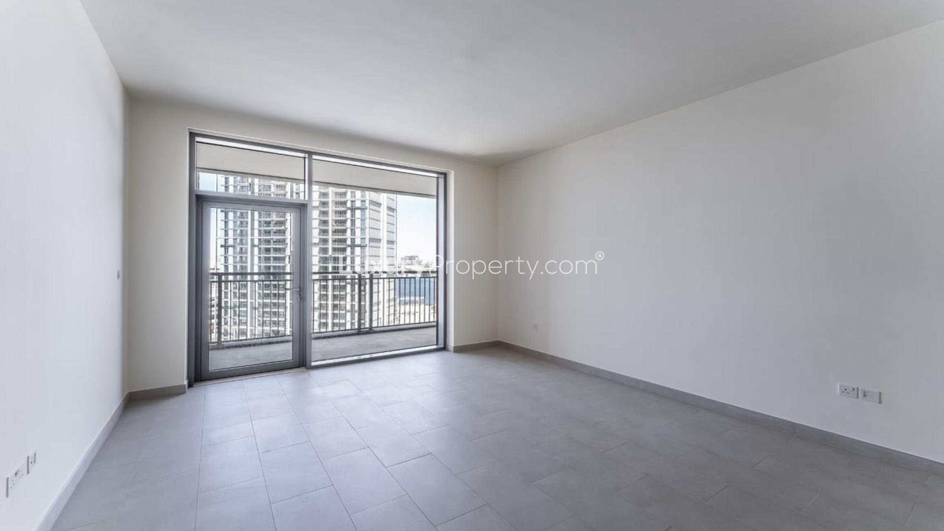 Spacious living area in Creek Rise apartment, Dubai Creek Harbour, with modern kitchen