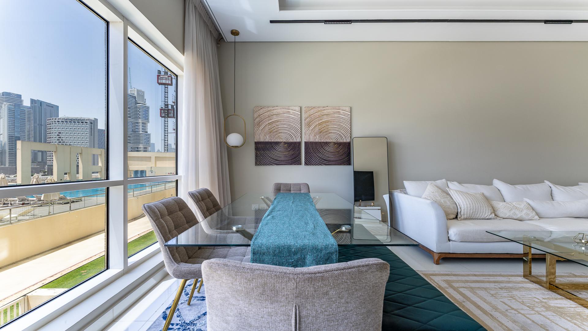 Modern living room in Business Bay apartment with elegant decor and large windows