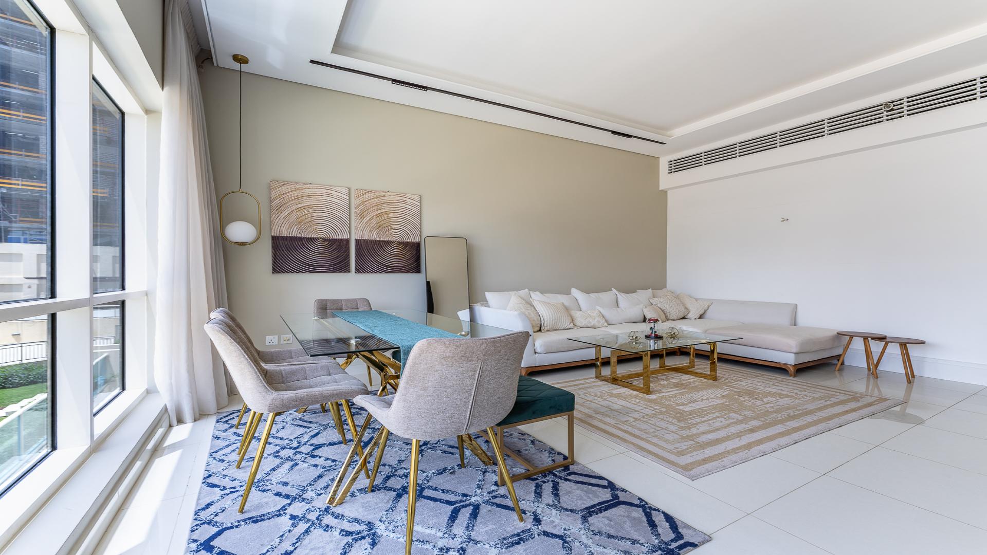 Modern interior of 2-bedroom apartment in Business Bay, featuring stylish dining and living area