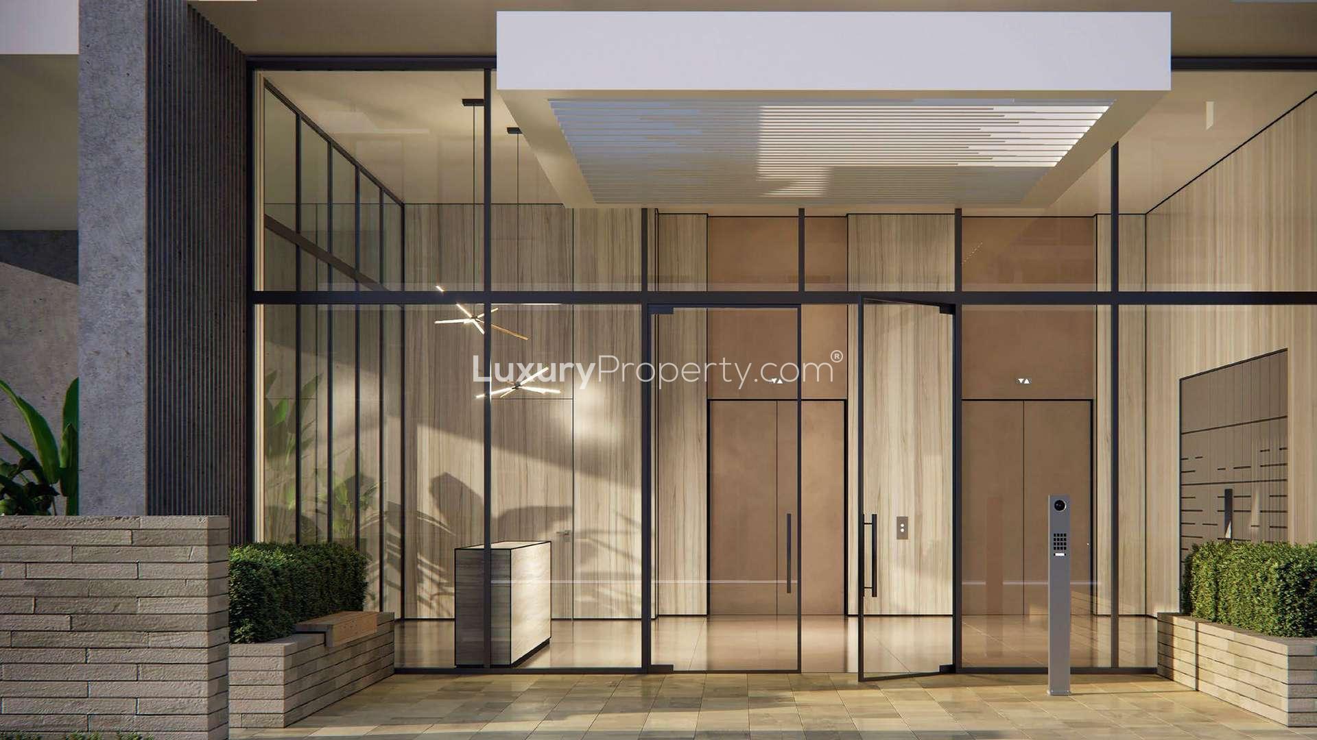 Luxurious beachfront apartment complex at sunset in Tilal Al Ghaf, Beachside Residences 3