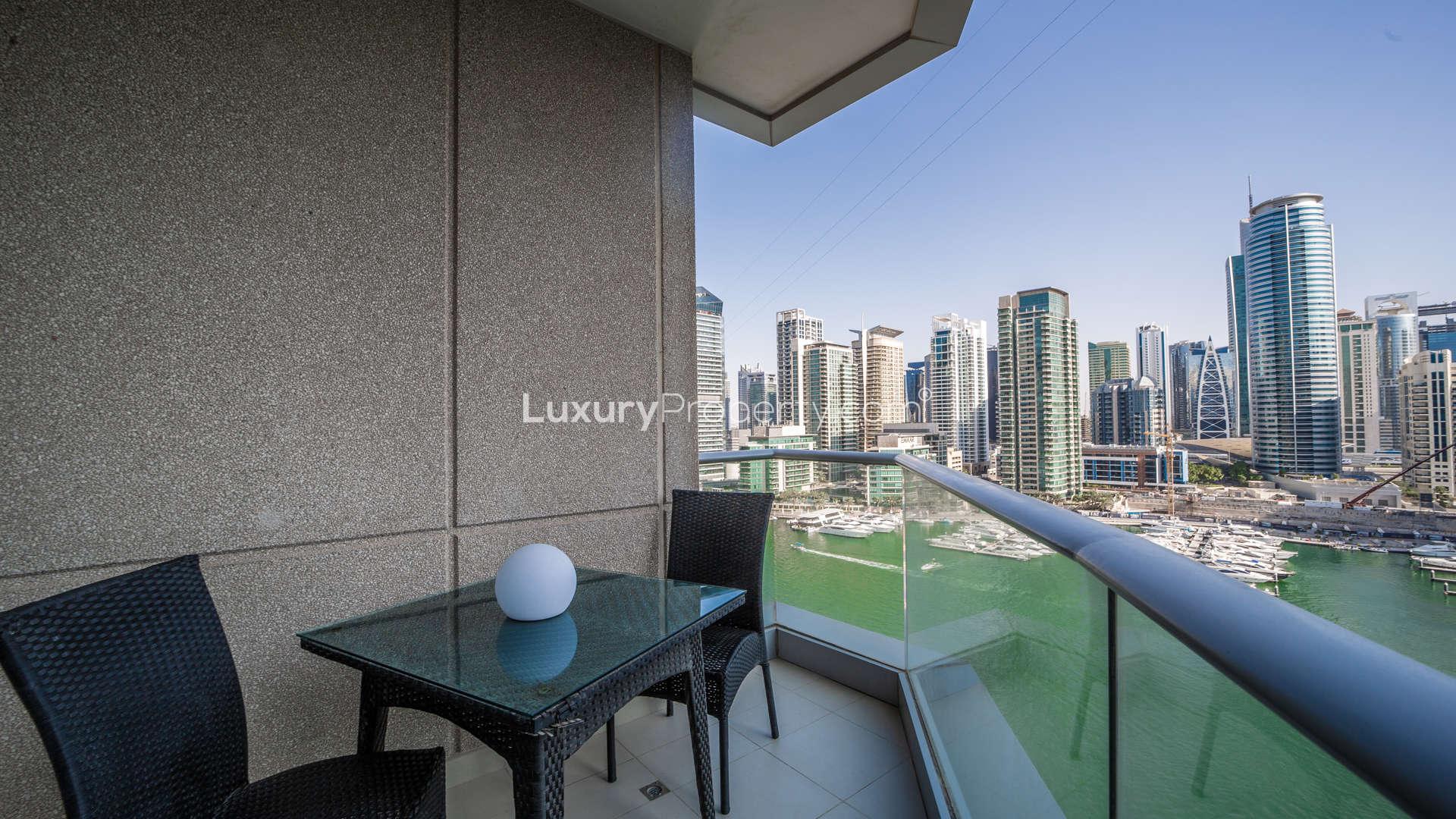 Luxurious bathroom in 2-bedroom apartment, Beauport, Dubai Marina, features double vanity and bathtub