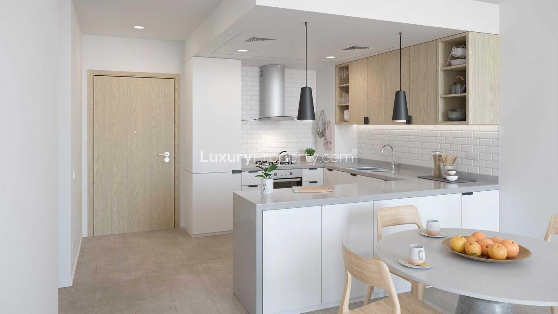 Floor plan of two-bedroom apartment with pool and amenities in Belgravia Heights, JVC