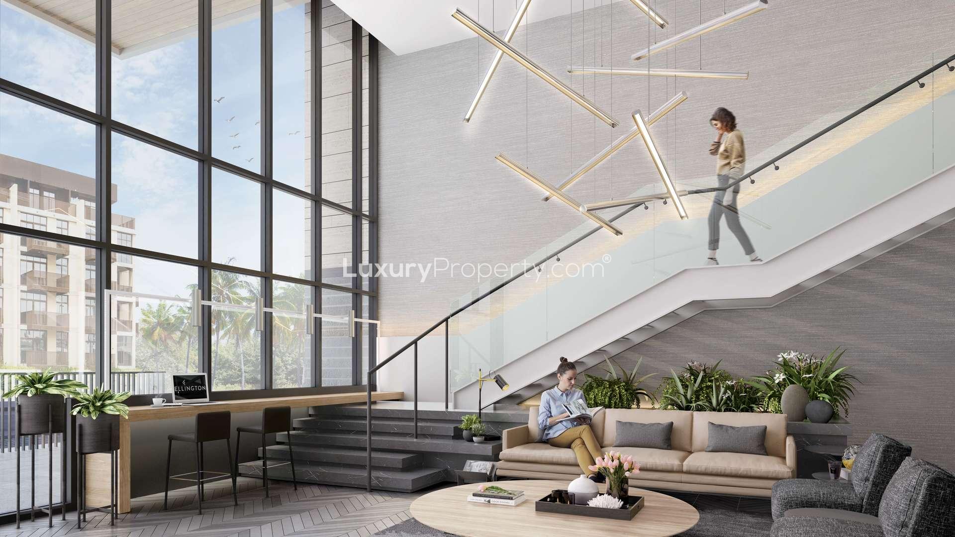 Luxurious lobby of Belgravia Square apartment, JVC Dubai, featuring modern design and seating area