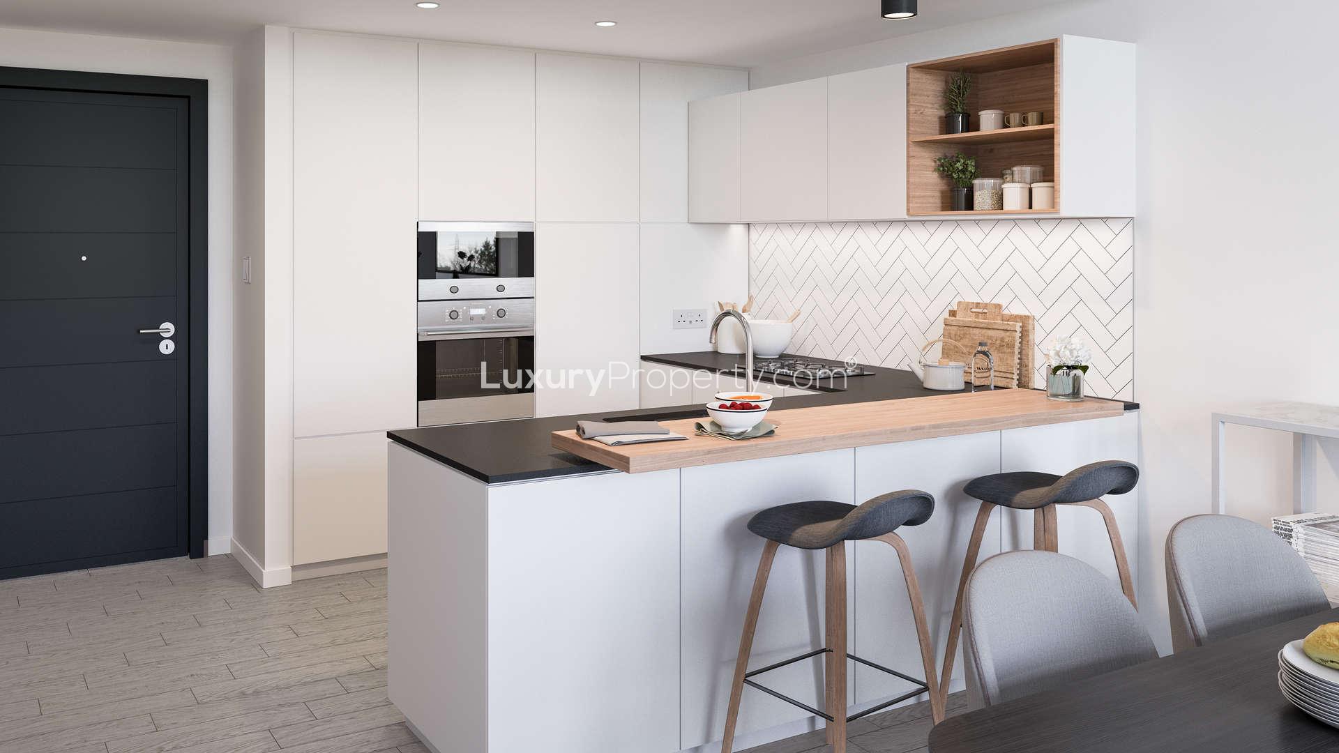 Modern living room in Belgravia Square, JVC Dubai apartment with stylish decor and natural light