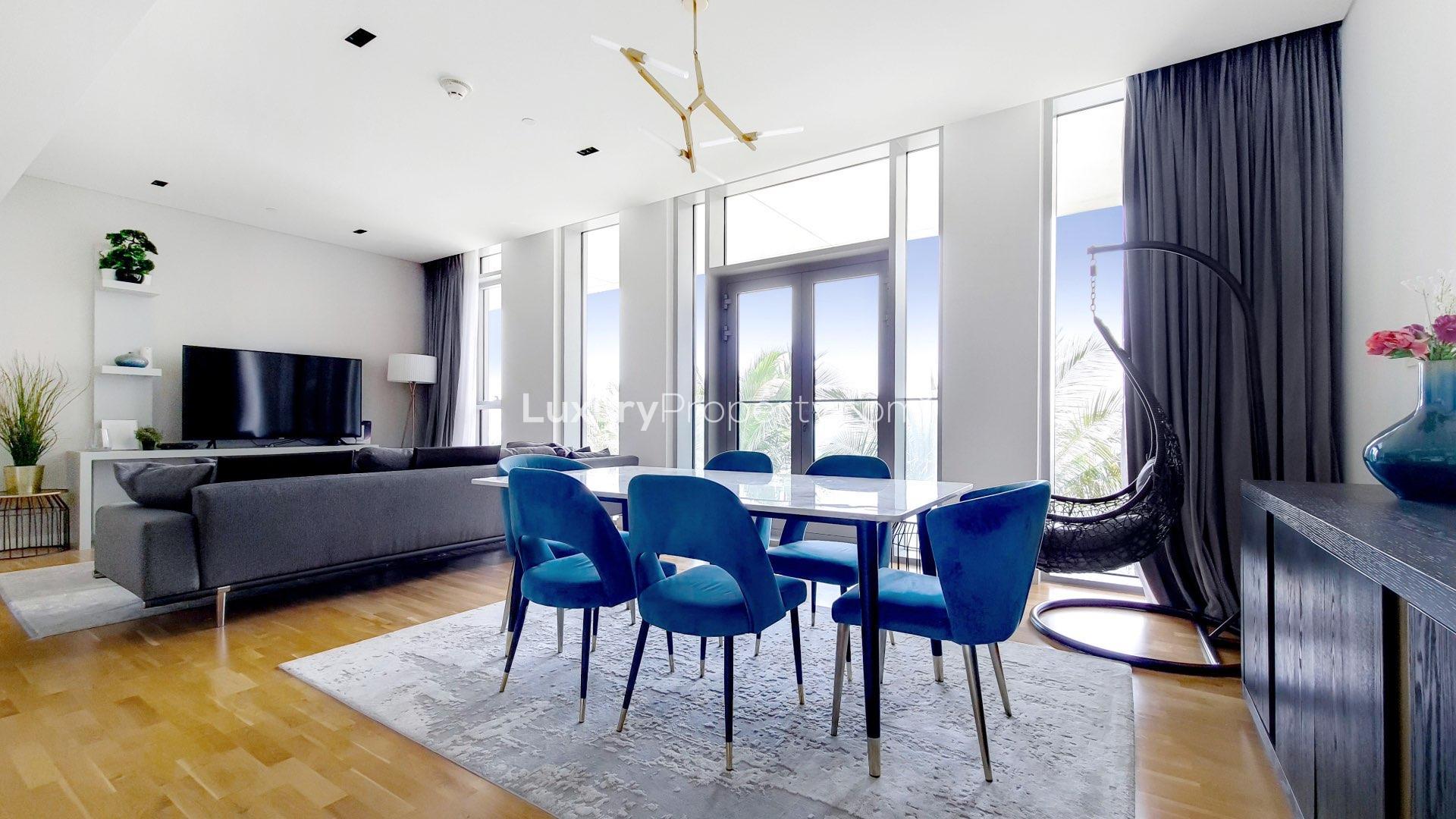 Luxurious living room in Bluewaters Residences apartment, featuring modern decor and natural light