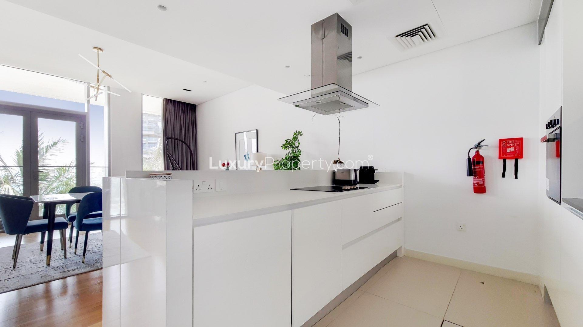 Modern open-plan living and dining area in Bluewaters Residences apartment for rent