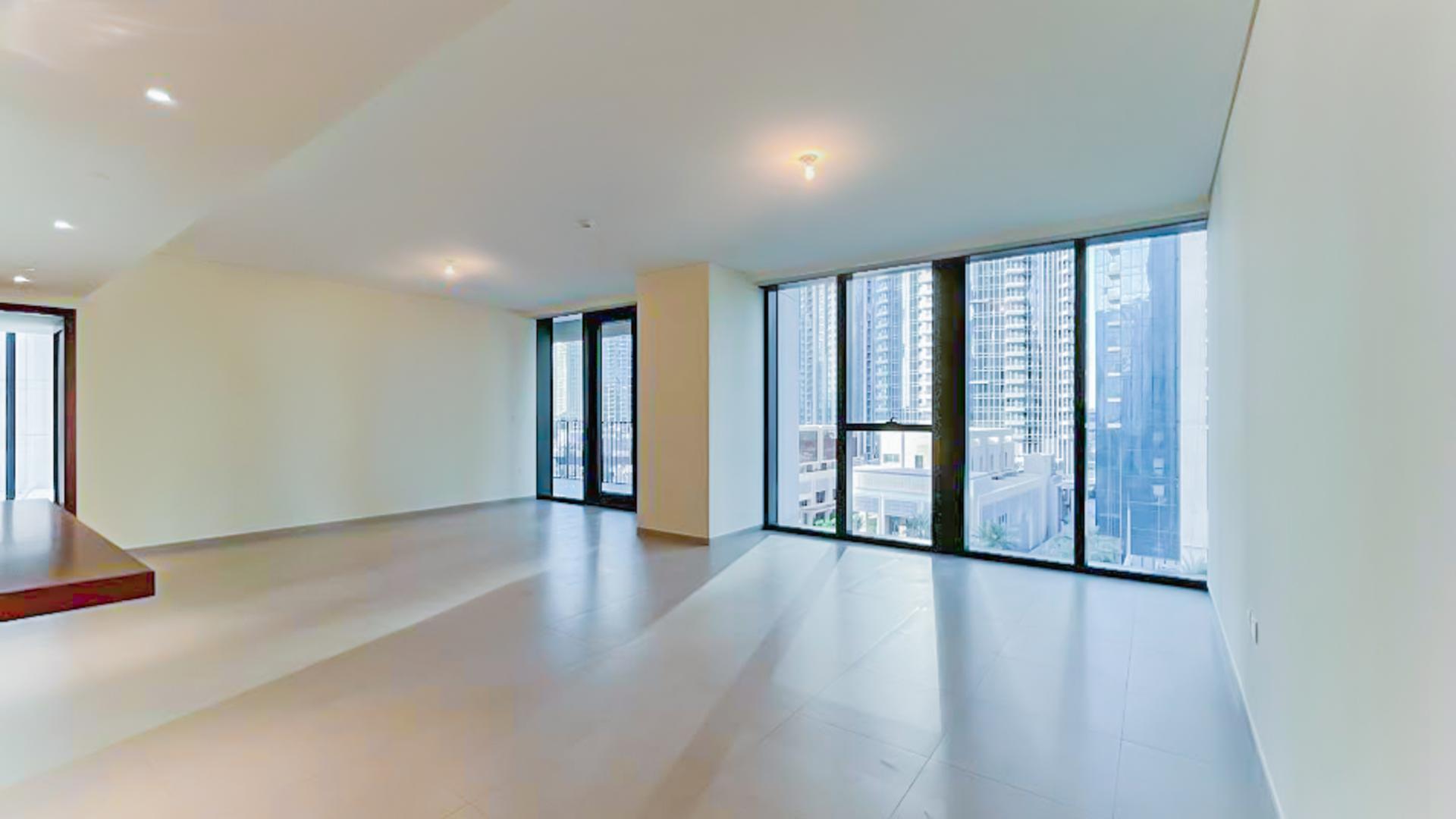 Modern apartment interior with large windows and city view in BLVD Heights, Downtown Dubai