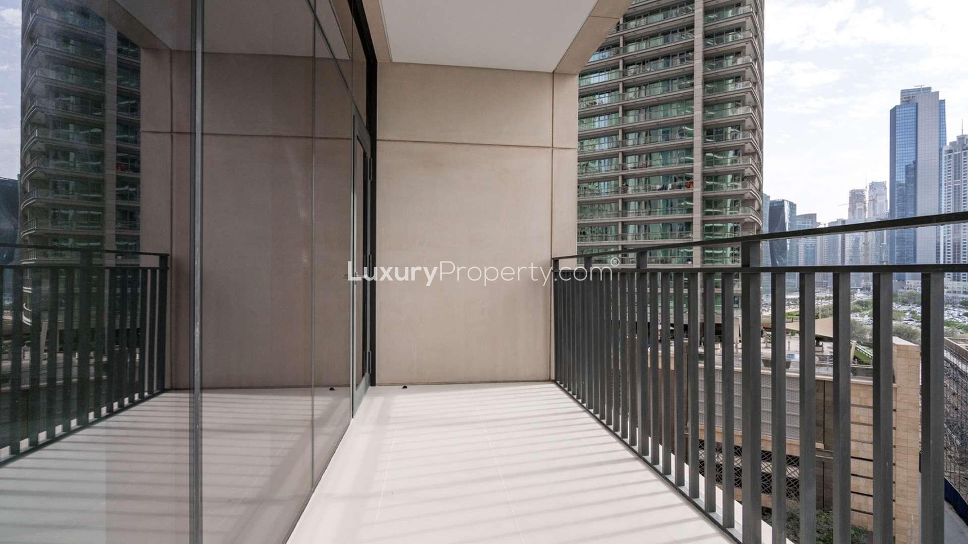 Modern kitchen in 2-bedroom apartment, Boulevard Crescent, Downtown Dubai, with sleek countertops and appliances