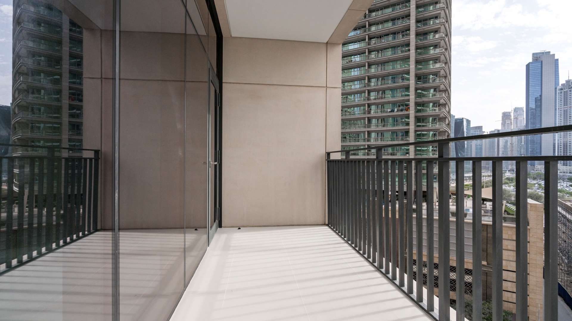 Modern kitchen in 2-bedroom apartment, Boulevard Crescent, Downtown Dubai, with sleek countertops and appliances