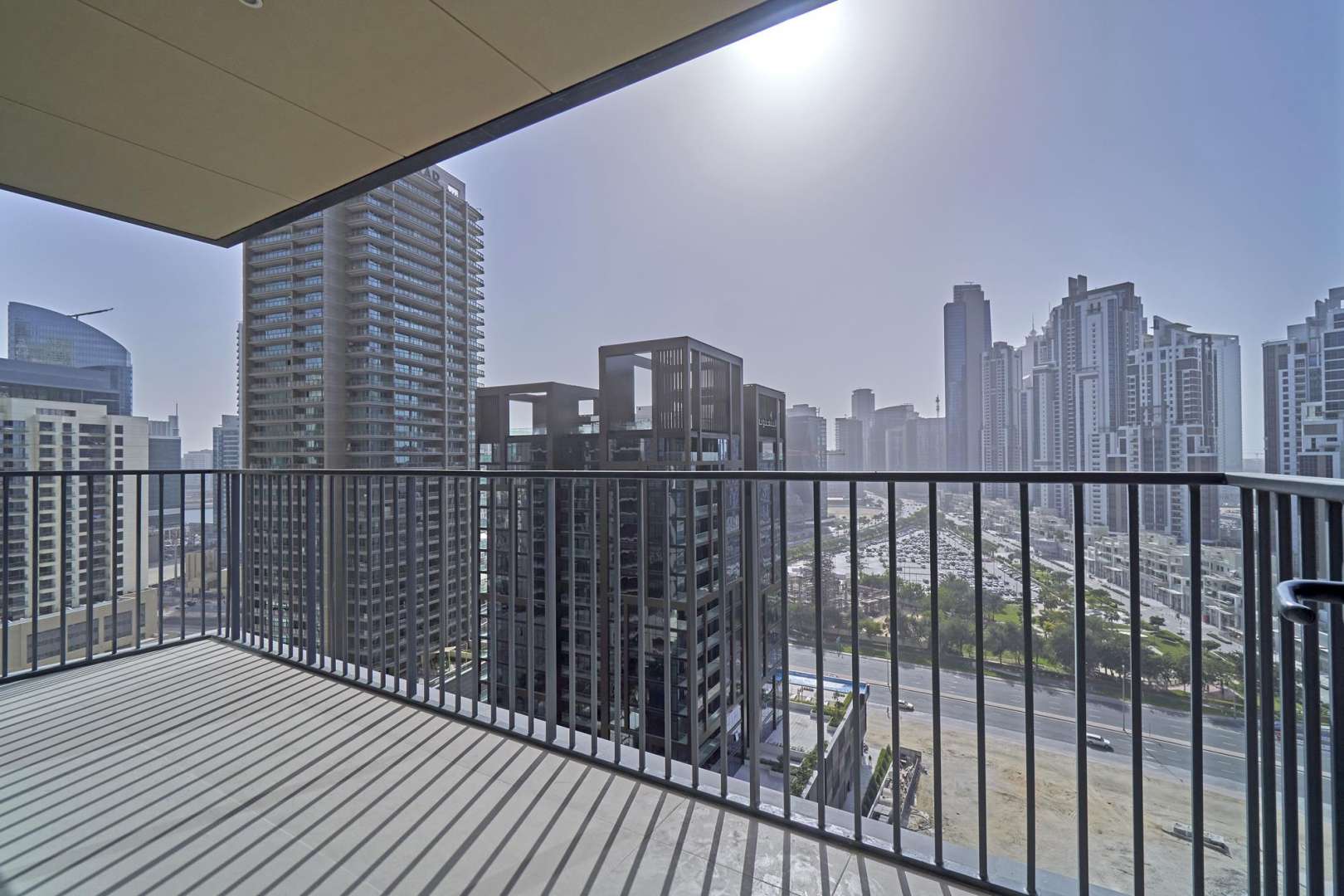 Spacious living room in BLVD Heights Tower 2 apartment, Downtown Dubai, with balcony view