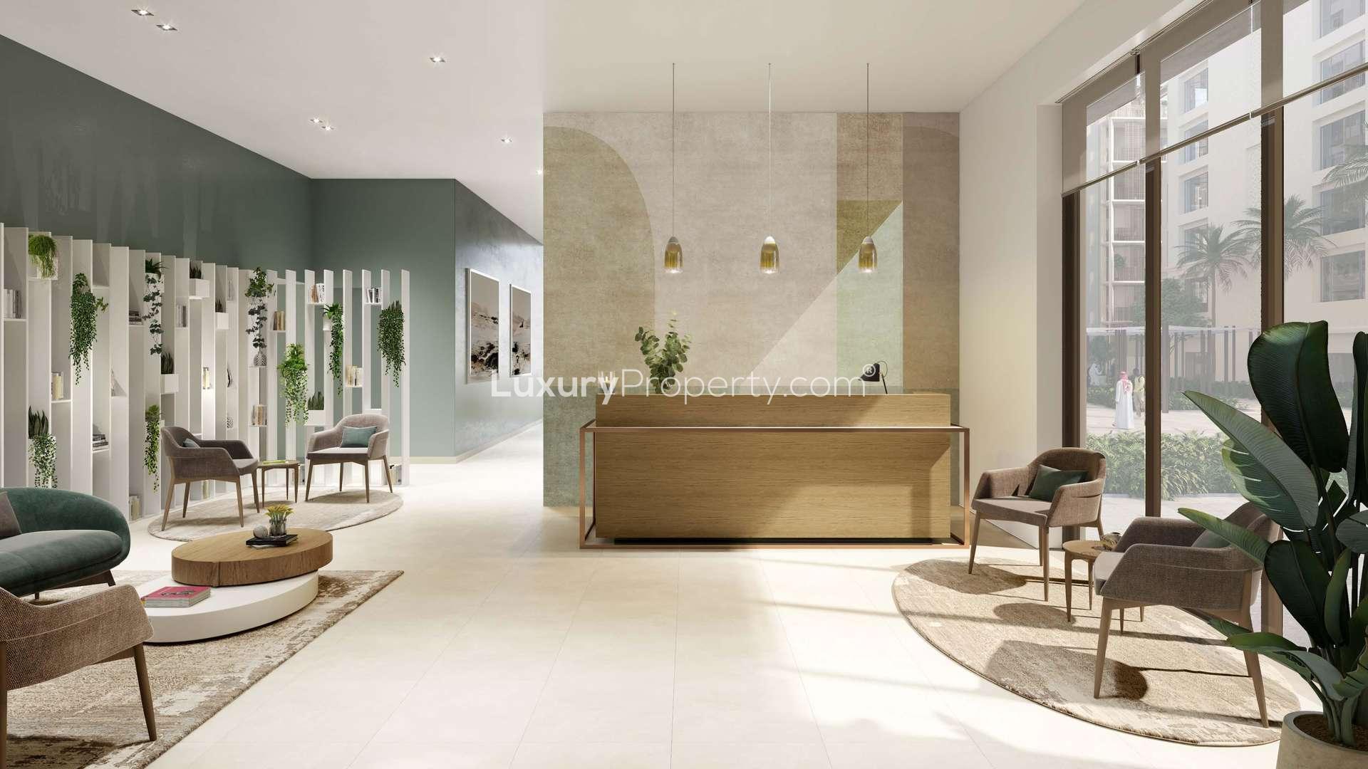 "Elegant poolside view at Breeze, Dubai Creek Harbour luxury apartment complex for sale.",Modern lobby area in luxury apartment at Breeze, Dubai Creek Harbour, with elegant seating