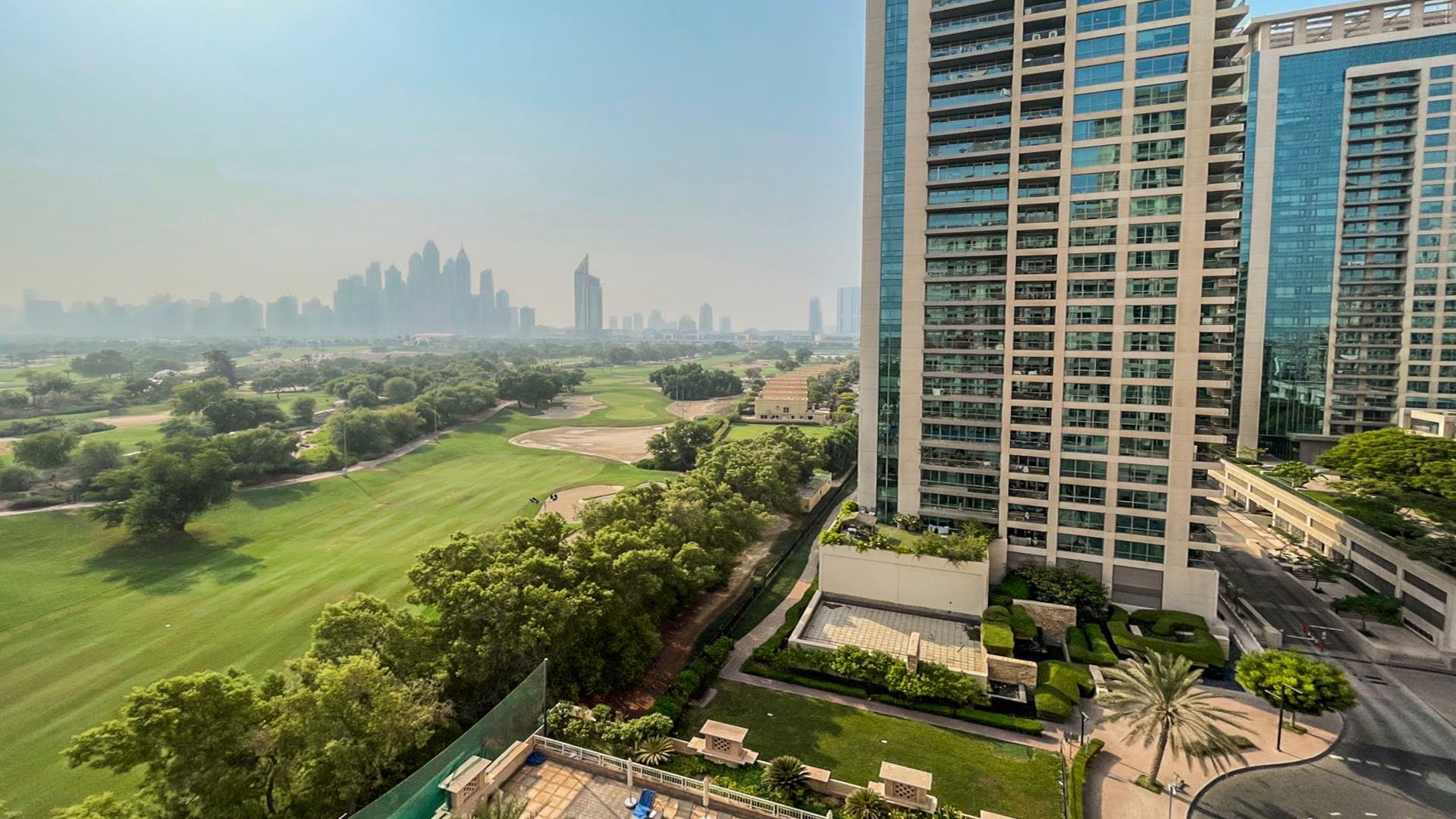 Bright living area in Tanaro apartment with skyline and golf course views