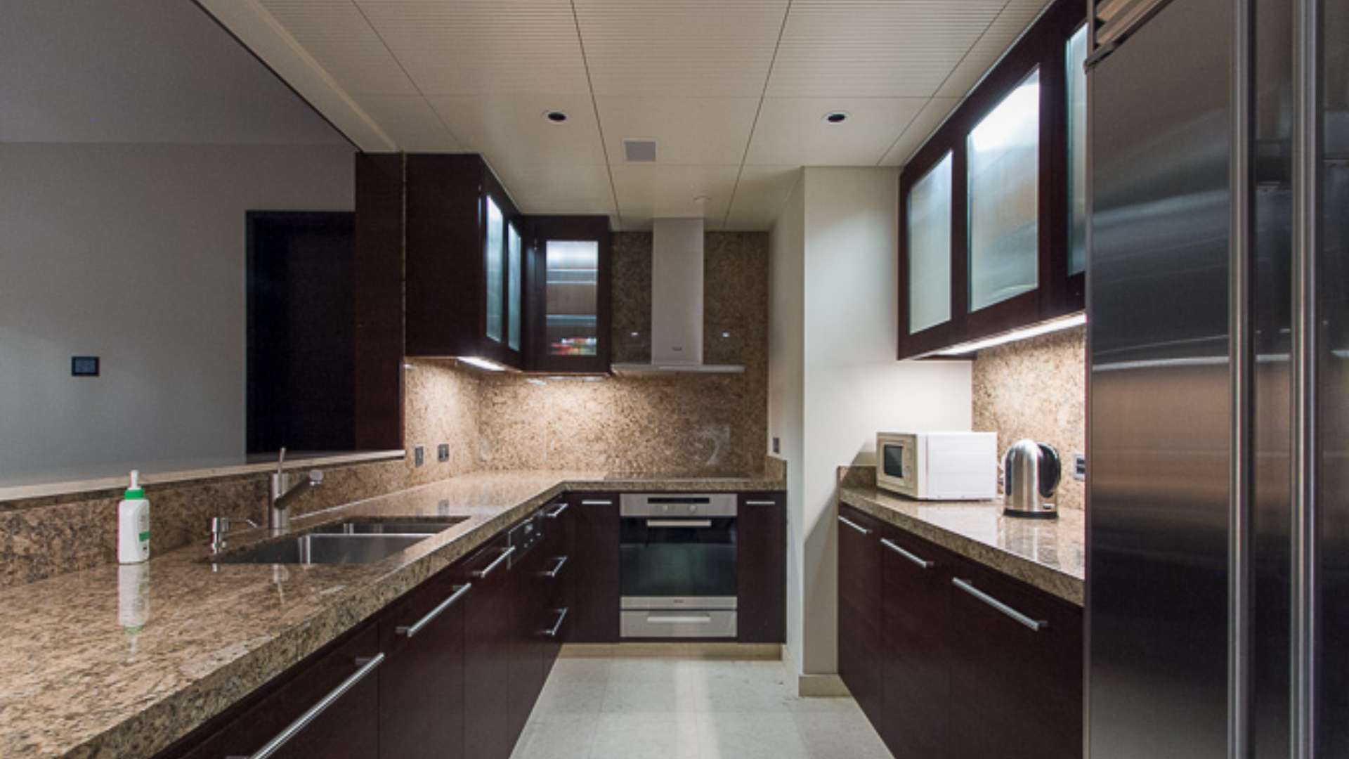 Aerial view of Downtown Dubai near Burj Khalifa, showcasing vibrant cityscape and water features