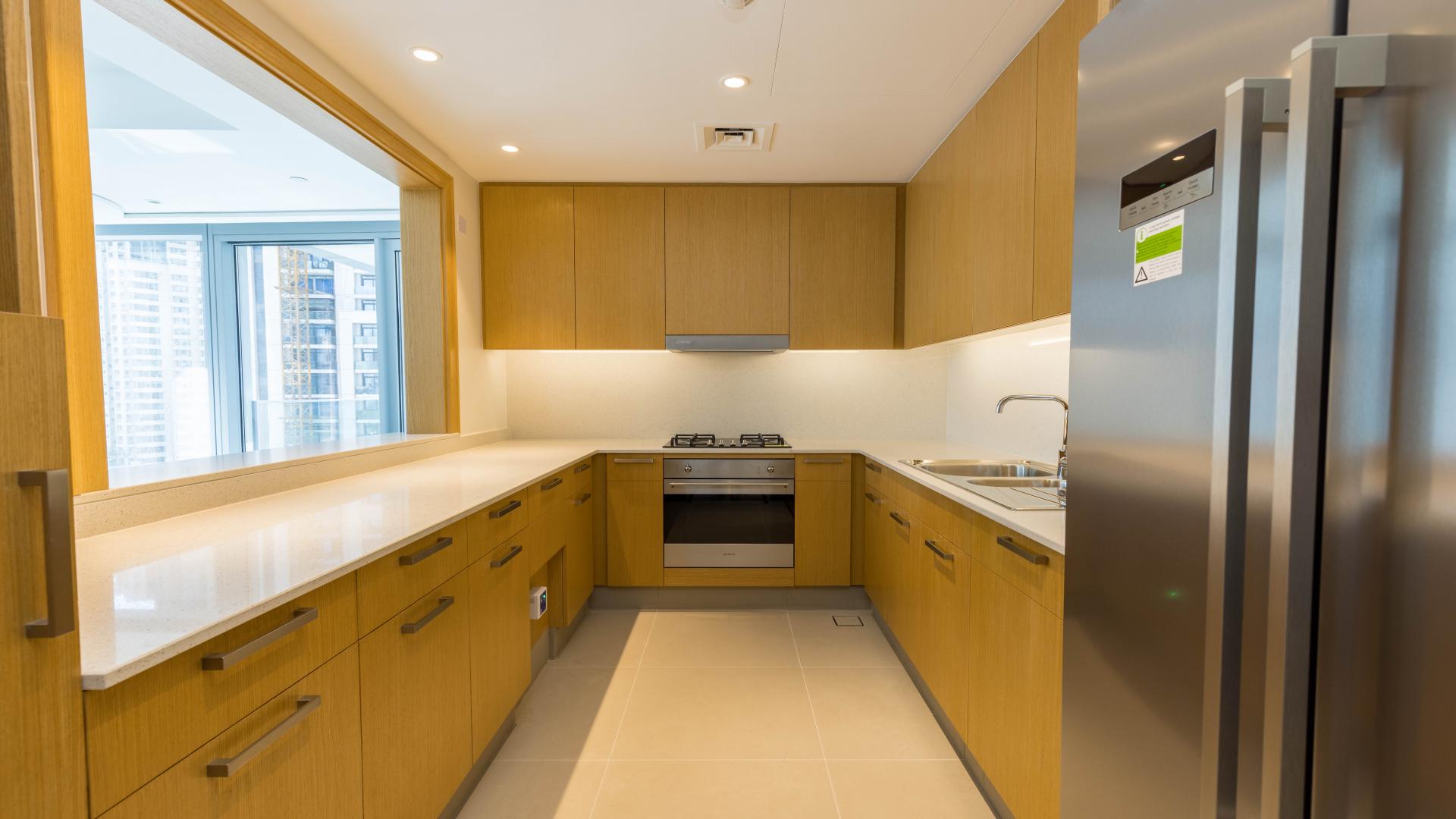 "Bright living area with city view in Downtown Dubai apartment for sale.","Bright, spacious room in brand new Downtown Dubai apartment with wooden doors and glossy floors.",Bright, spacious living area in brand new Downtown Dubai apartment for sale, Burj Khalifa Area