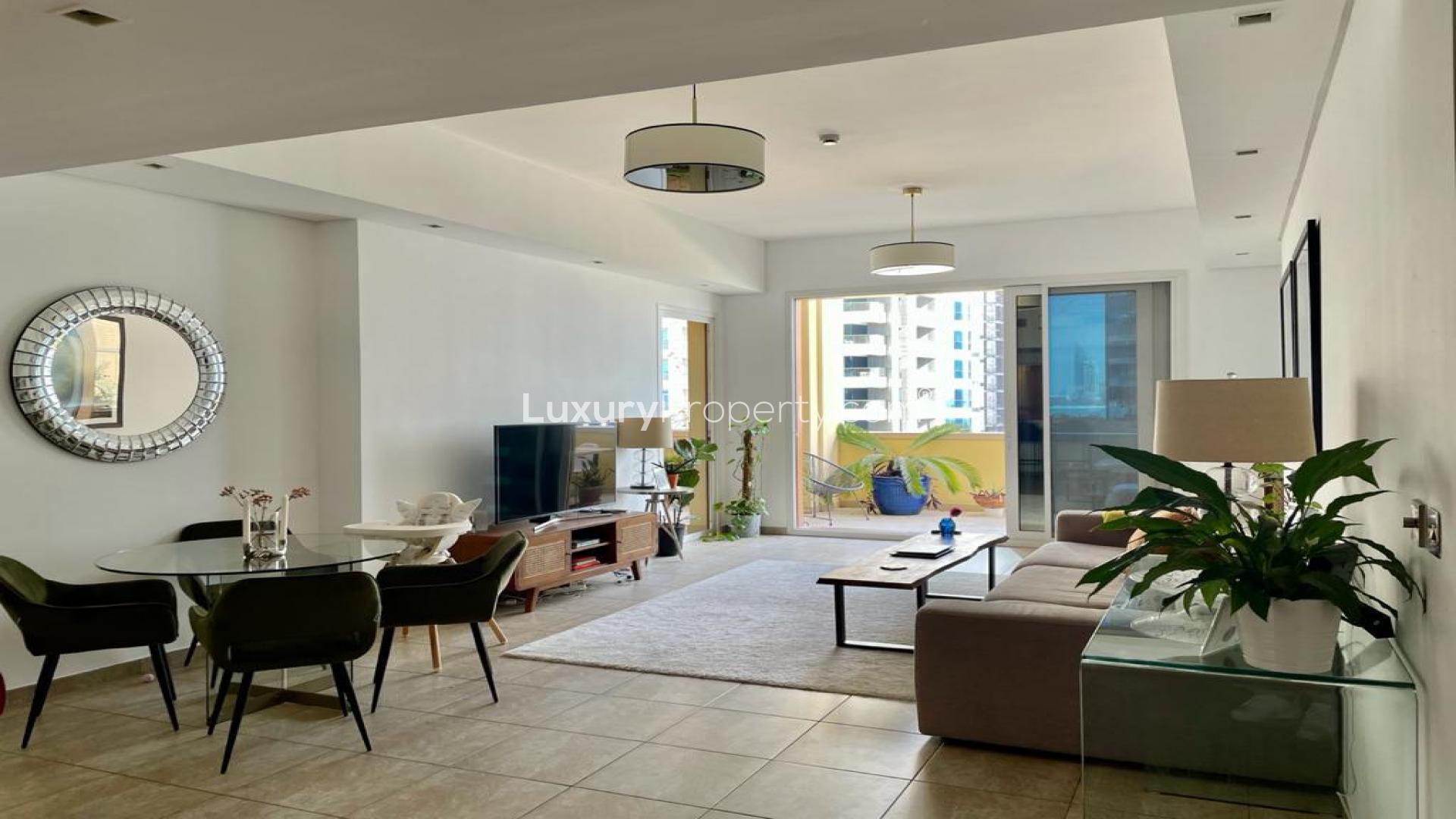 Elegant living room in 2-bedroom Palm Jumeirah apartment, featuring modern decor and open layout
