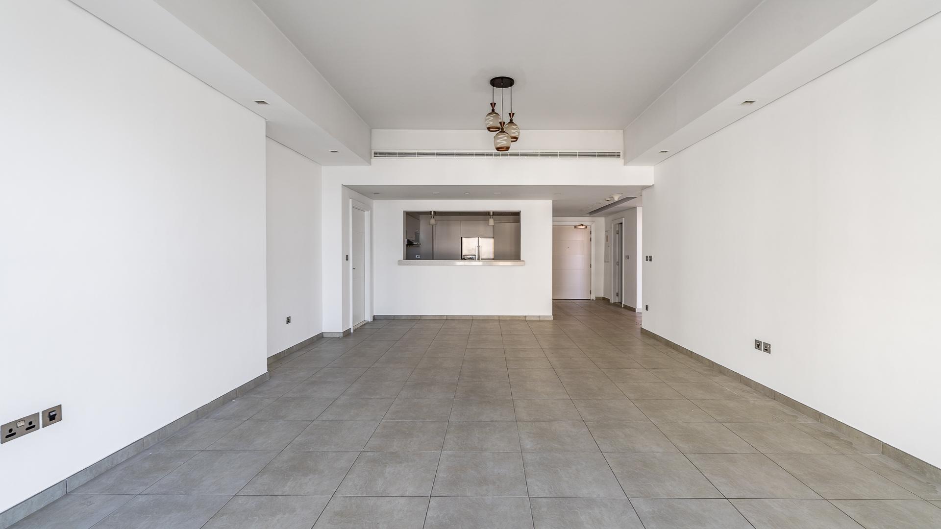 Empty living room in 2-bedroom apartment, Marina Residences 2, Palm Jumeirah, tiled floor, large window