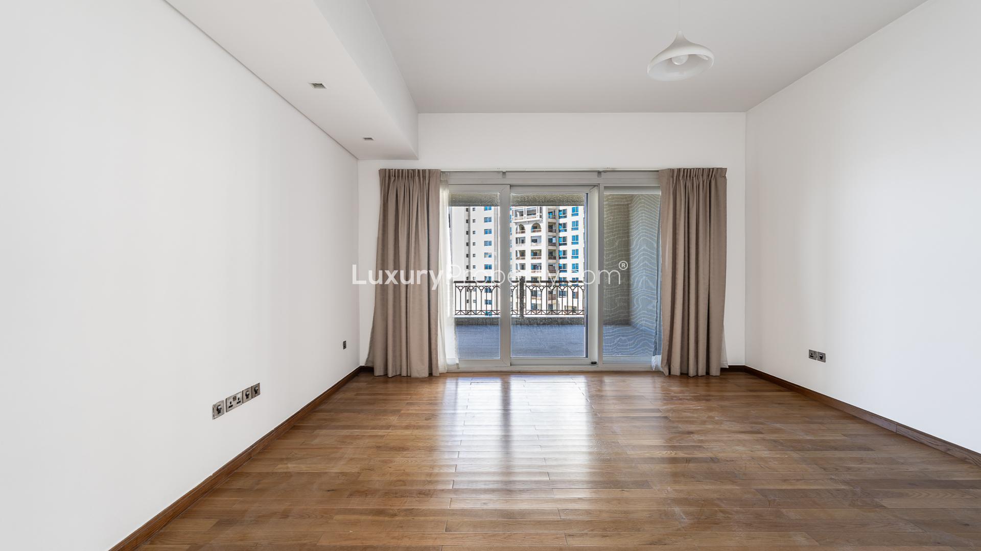 Empty living room in 2-bedroom apartment, Marina Residences 2, Palm Jumeirah, tiled floor, large window
