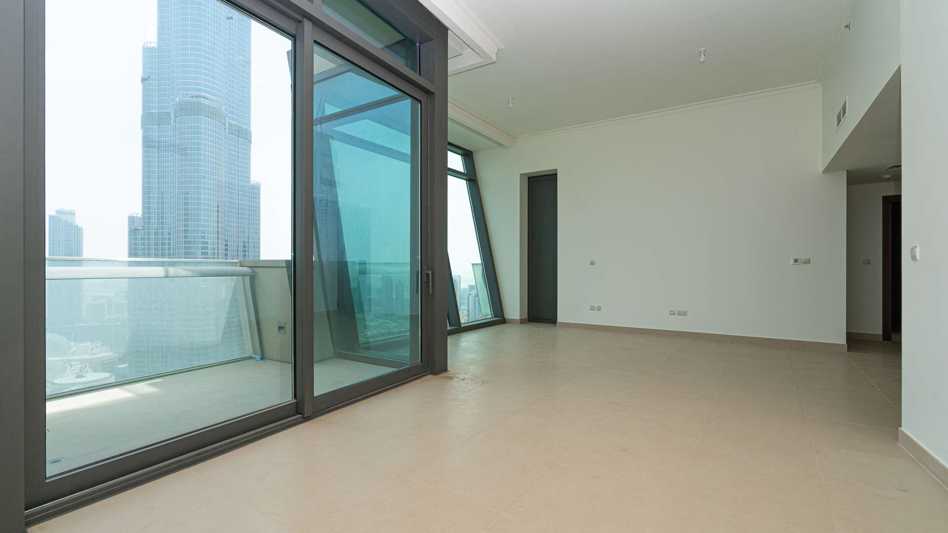 High-floor view from Burj Vista apartment, showcasing Downtown Dubai skyline and fountain