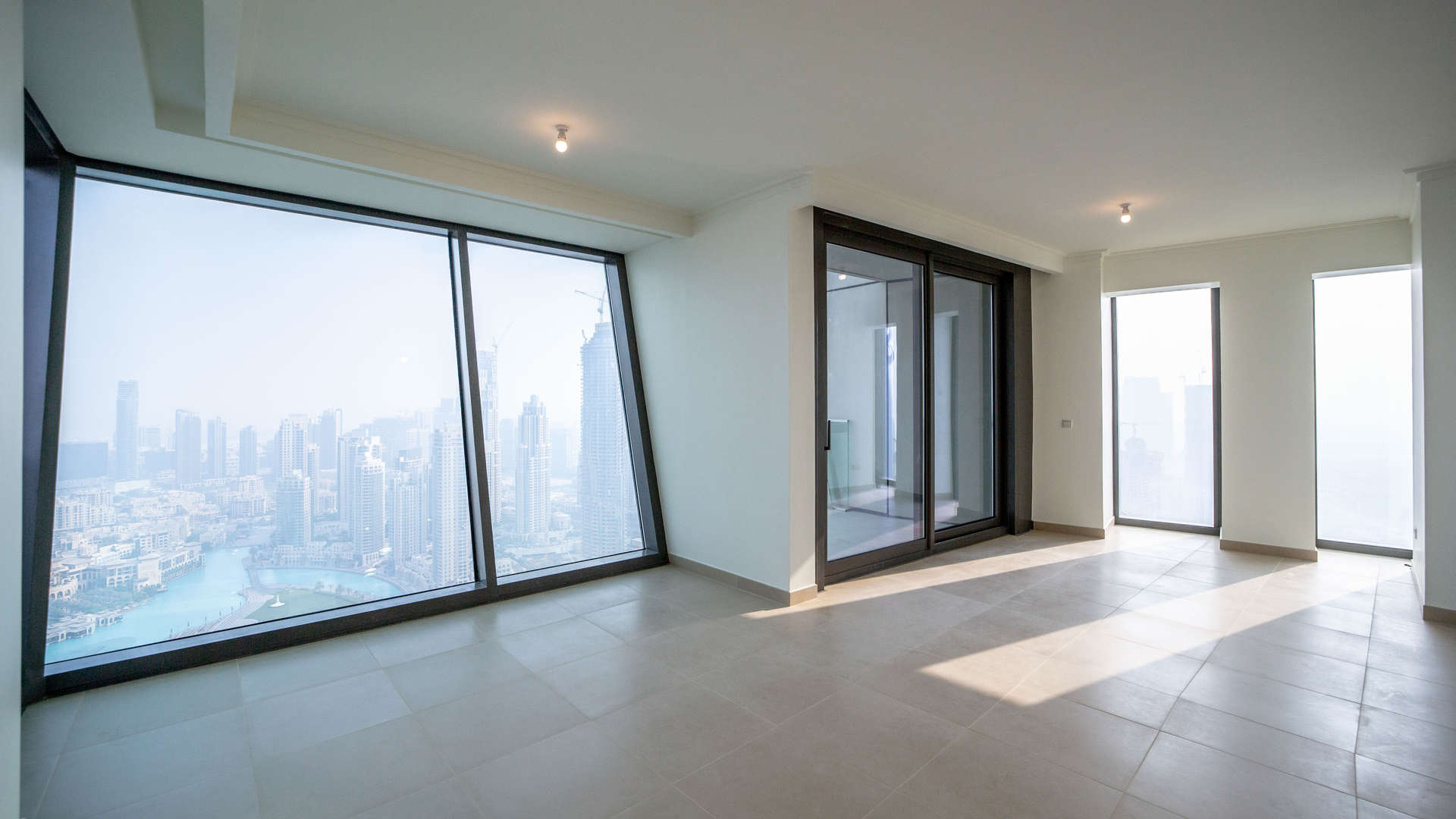 Spacious living room with city views in Burj Vista apartment, Downtown Dubai