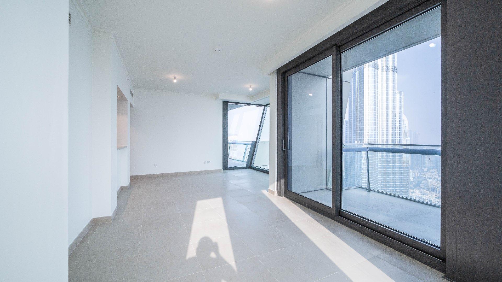 "Burj Vista apartment buildings with Burj Khalifa view in Downtown Dubai skyline.",Empty apartment in Burj Vista, Downtown Dubai with large windows showcasing Burj Khalifa views