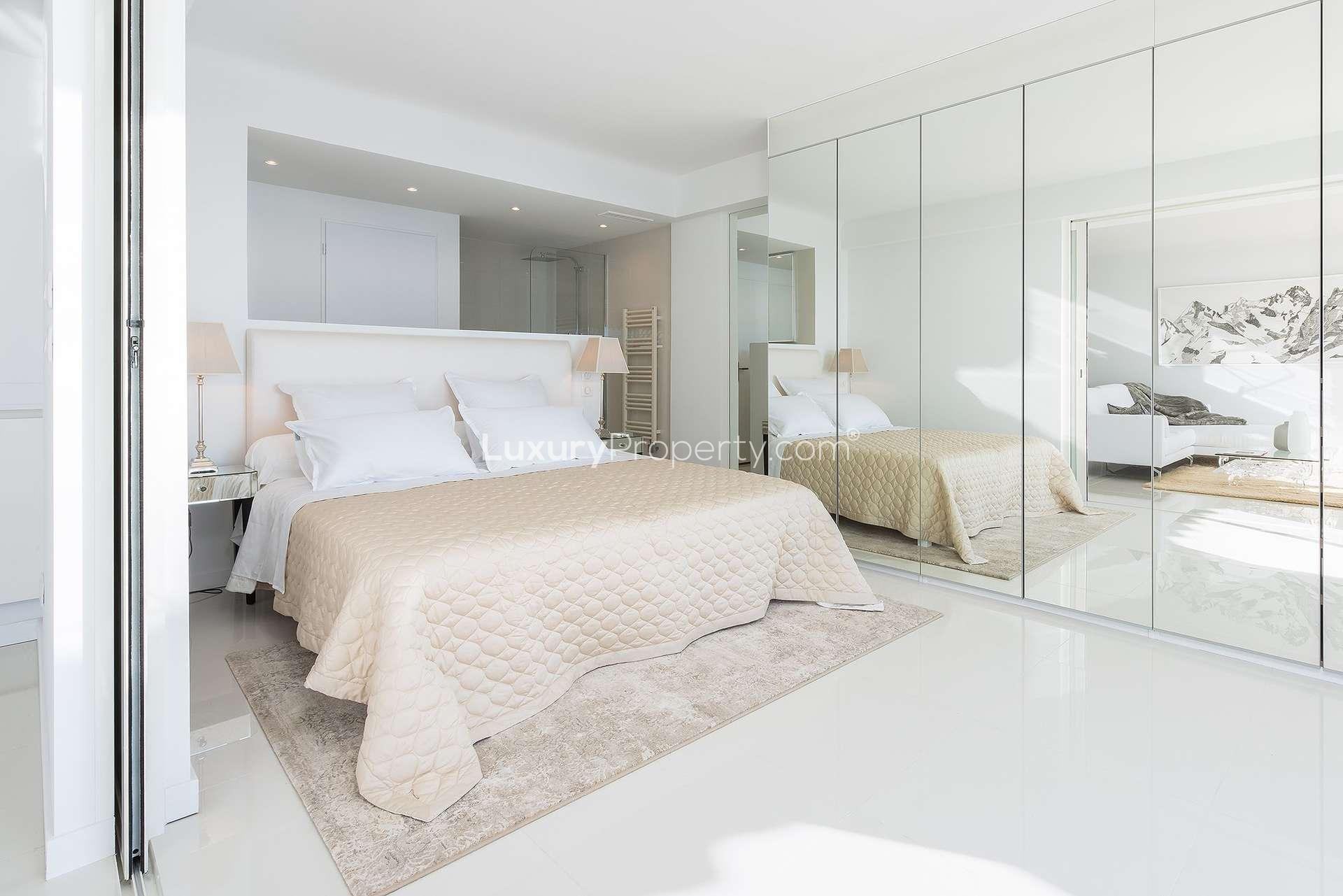 Luxurious bedroom in stylish 2-bedroom apartment, Cannes, French Riviera, with mirrored wardrobe