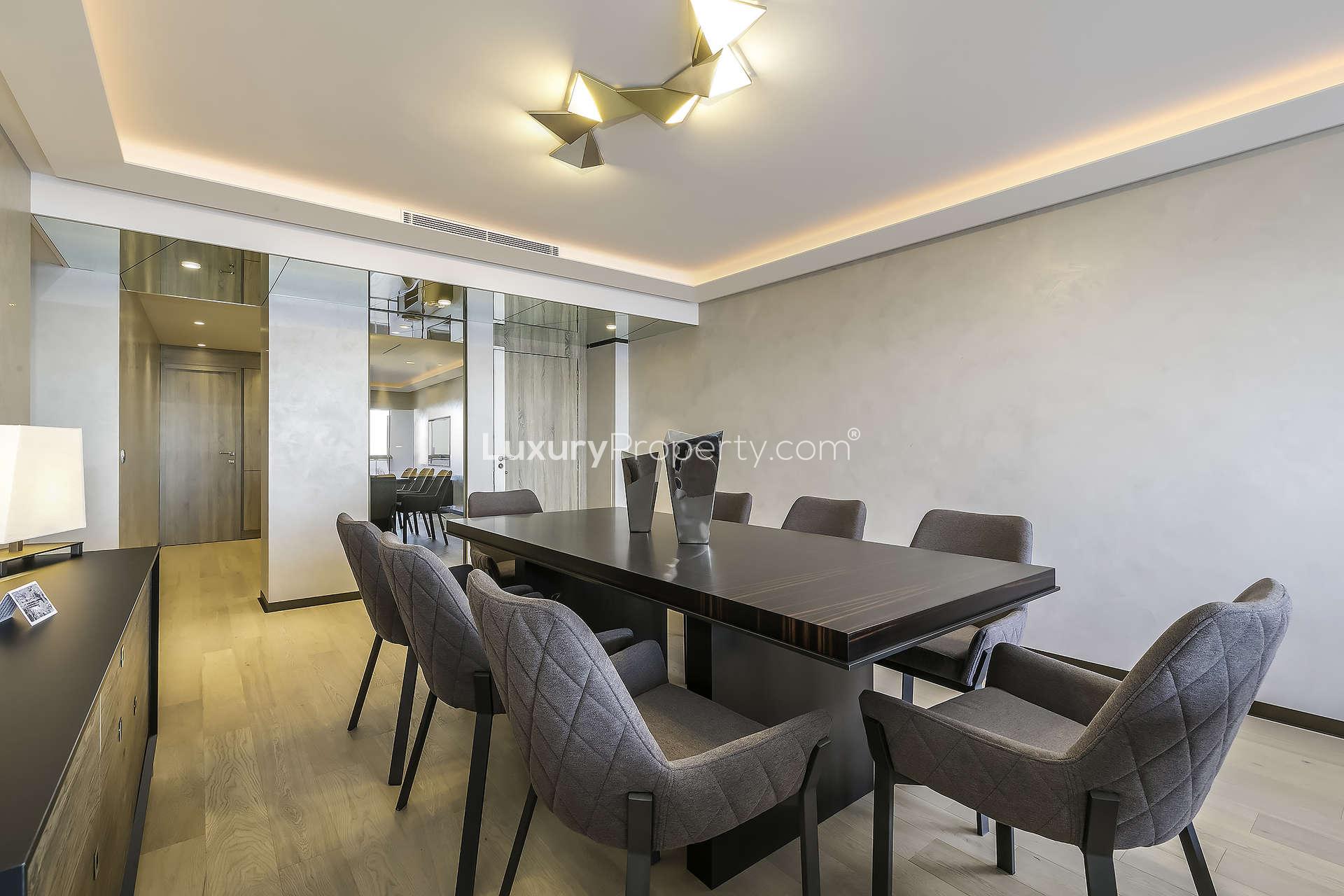 Chic Cannes apartment living room with modern decor and panoramic French Riviera views