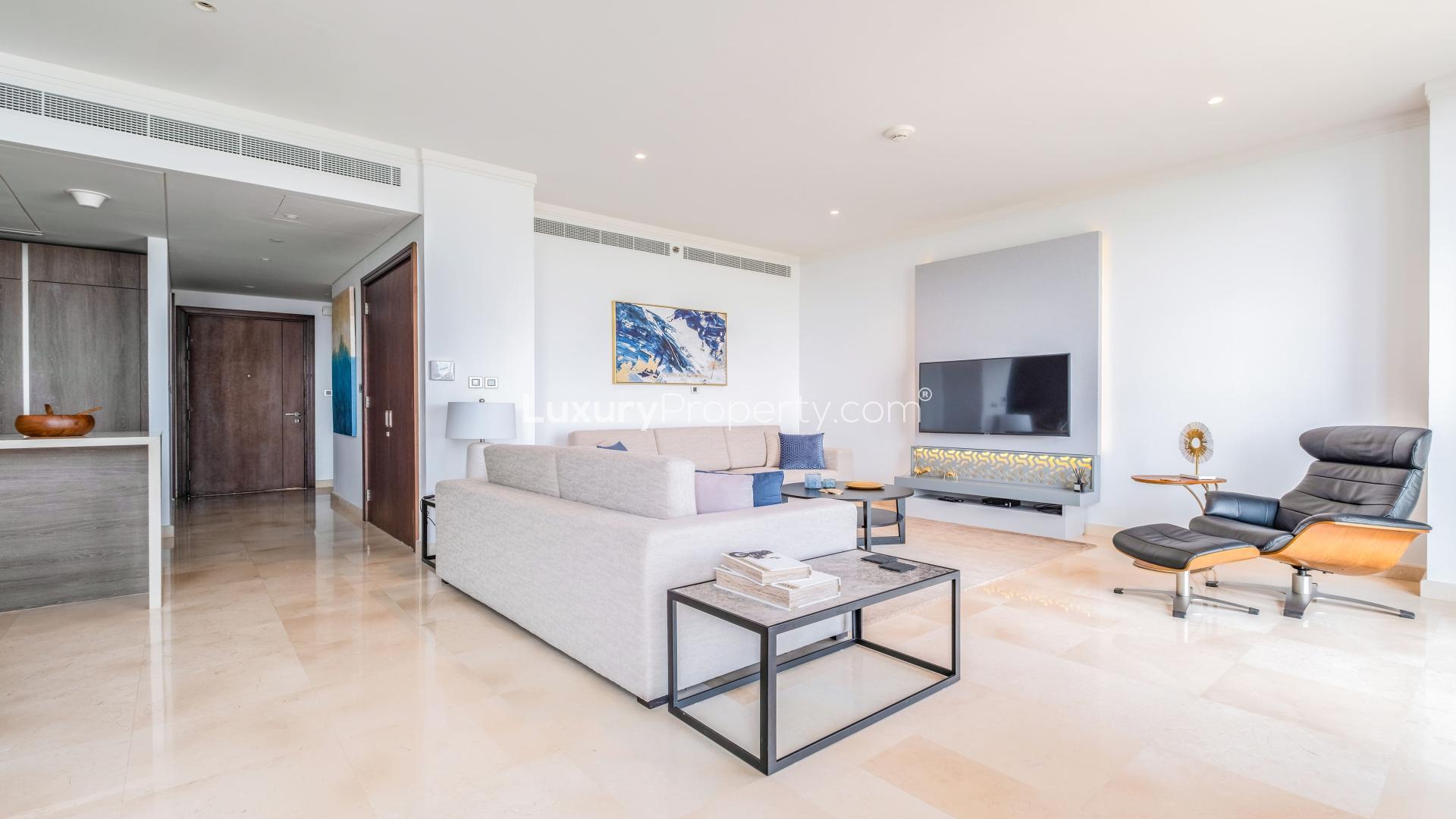 Modern living room in Jumeirah Lake Towers apartment with sleek furnishings and natural light