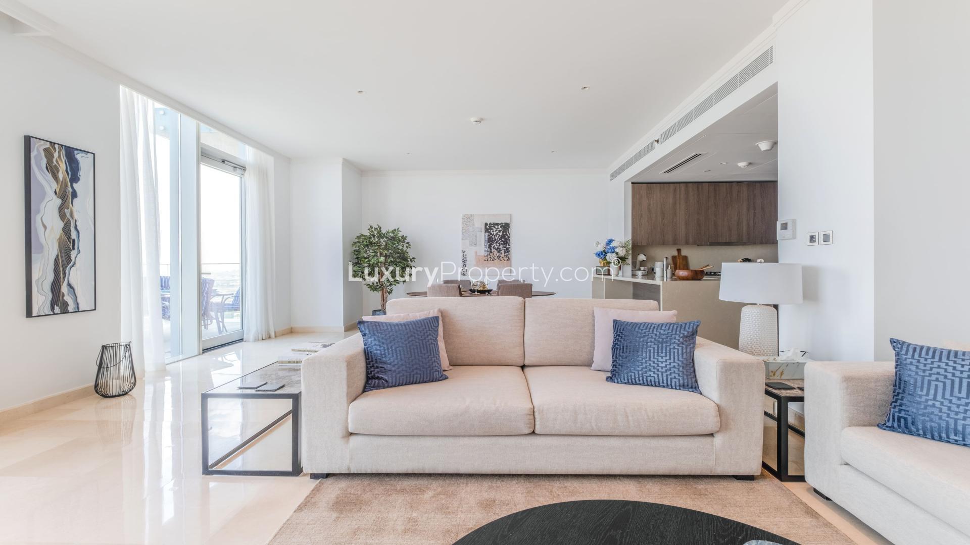 "Stunning golf course view from Jumeirah Lake Towers apartment for sale, The Residences JLT.",Luxurious living room in Jumeirah Lake Towers apartment with modern decor and open layout