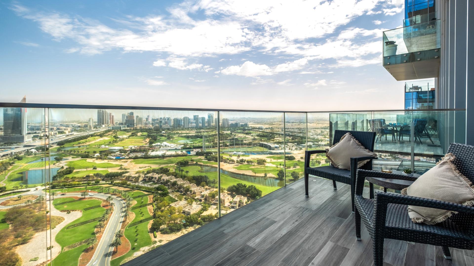 "Stunning golf course view from Jumeirah Lake Towers apartment for sale, The Residences JLT.",Balcony view of golf course from luxury apartment in The Residences JLT, Jumeirah Lake Towers