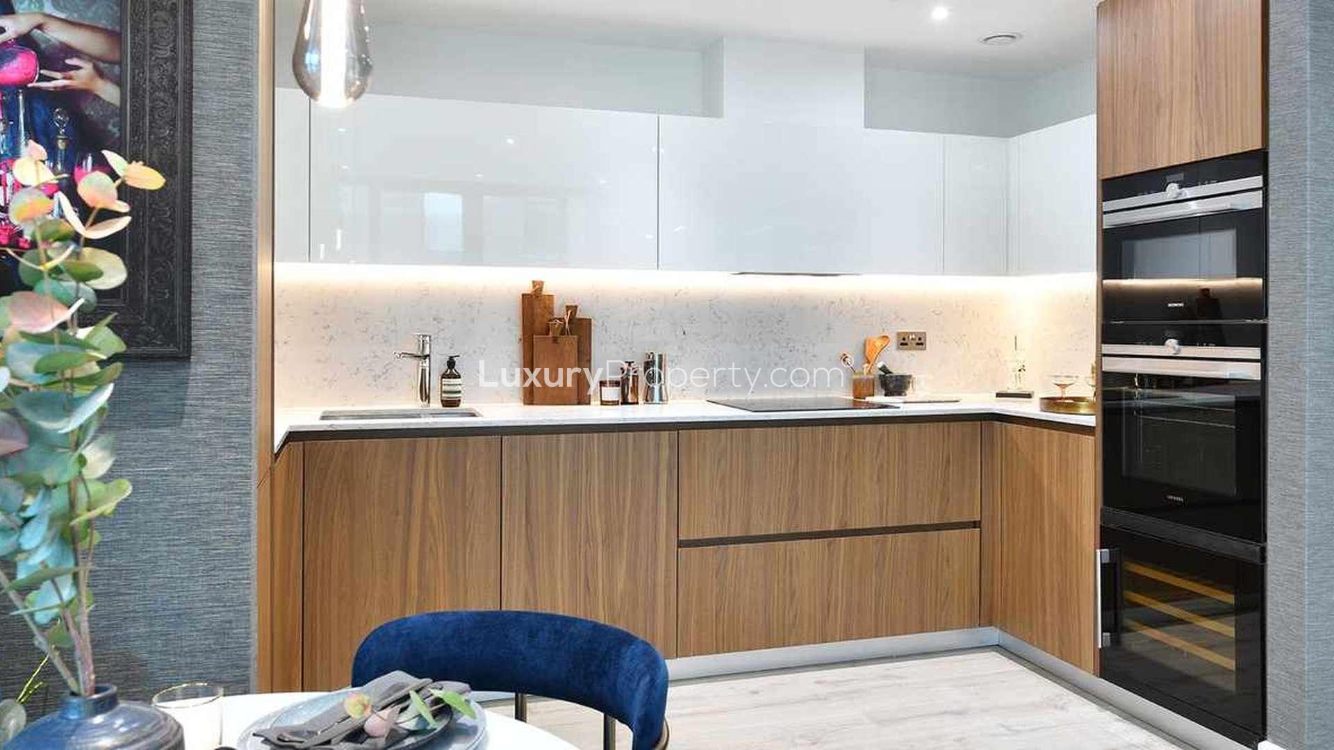 Modern living room and kitchen in Cassia House apartment, Aldgate. Luxurious interior design