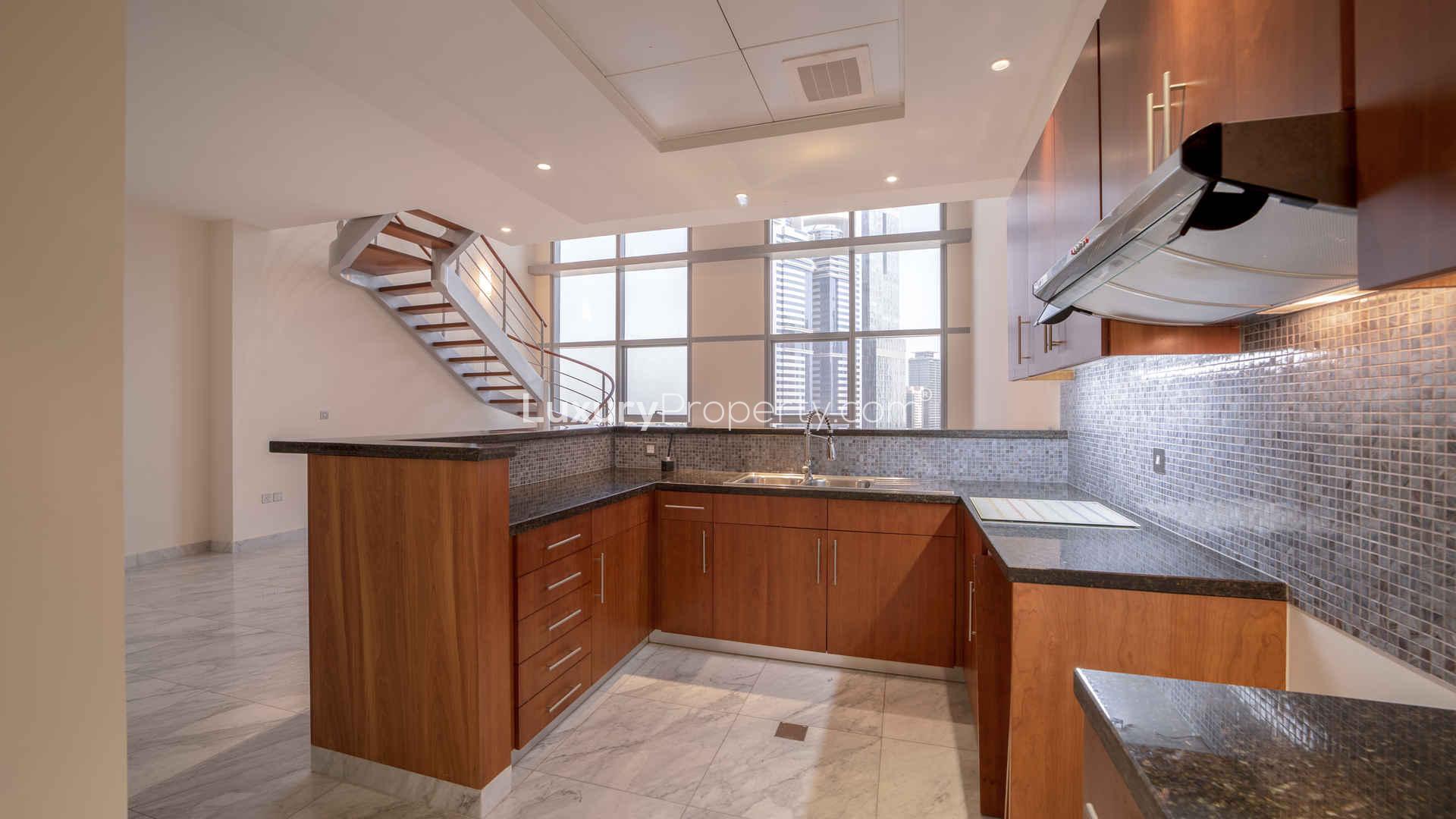 Stunning duplex apartment with staircase and large windows in Central Park Towers, DIFC