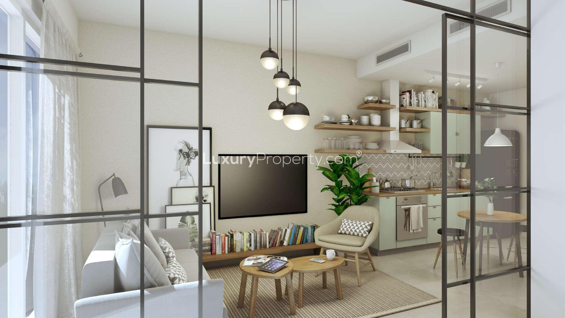 Family enjoying park in Dubai Hills Estate near contemporary apartment for sale